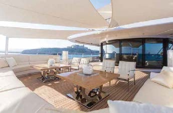 a room with a table and chairs aboard LADY LARA Yacht for Sale