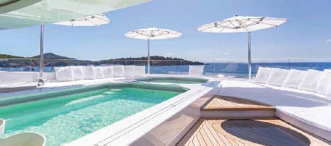 a pool with umbrellas aboard LADY LARA Yacht for Sale