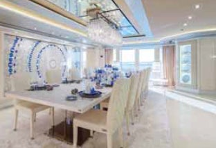 a room with a table chairs and a window aboard LADY LARA Yacht for Sale