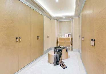 a room with a large mirror and a table with chairs aboard LADY LARA Yacht for Sale