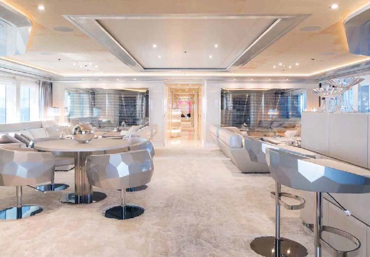 a large room with tables and chairs aboard LADY LARA Yacht for Sale