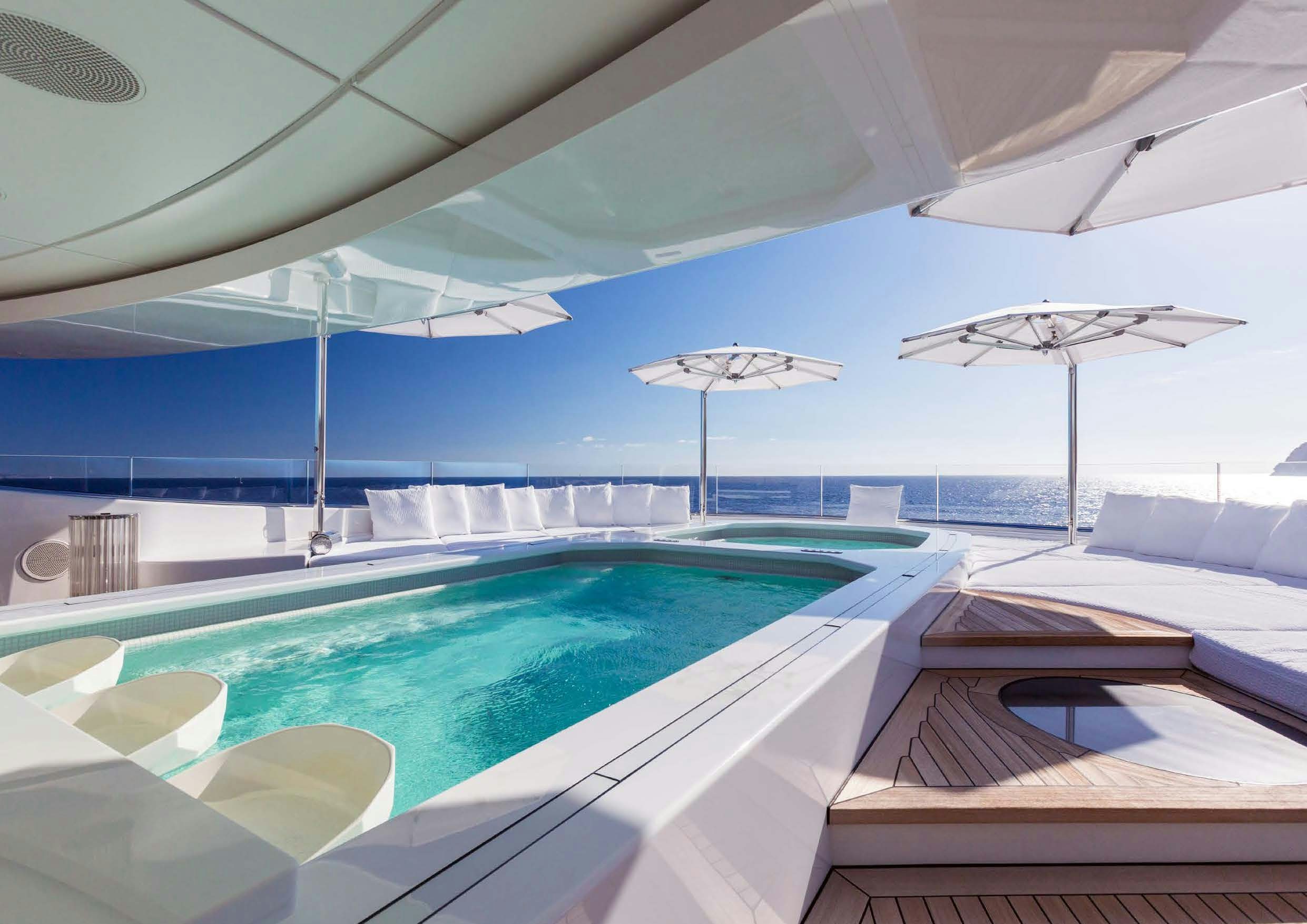 a pool with umbrellas aboard LADY LARA Yacht for Sale