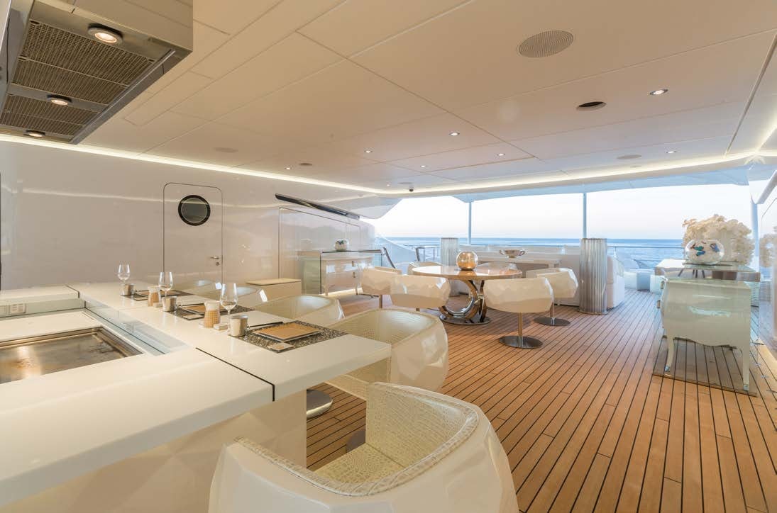 a room with a large table and chairs aboard LADY LARA Yacht for Sale