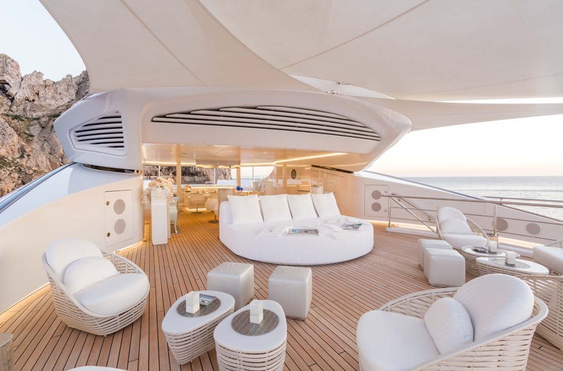 a large white lounge chair on a deck with a large white lounge chair and a large white lounge aboard LADY LARA Yacht for Sale