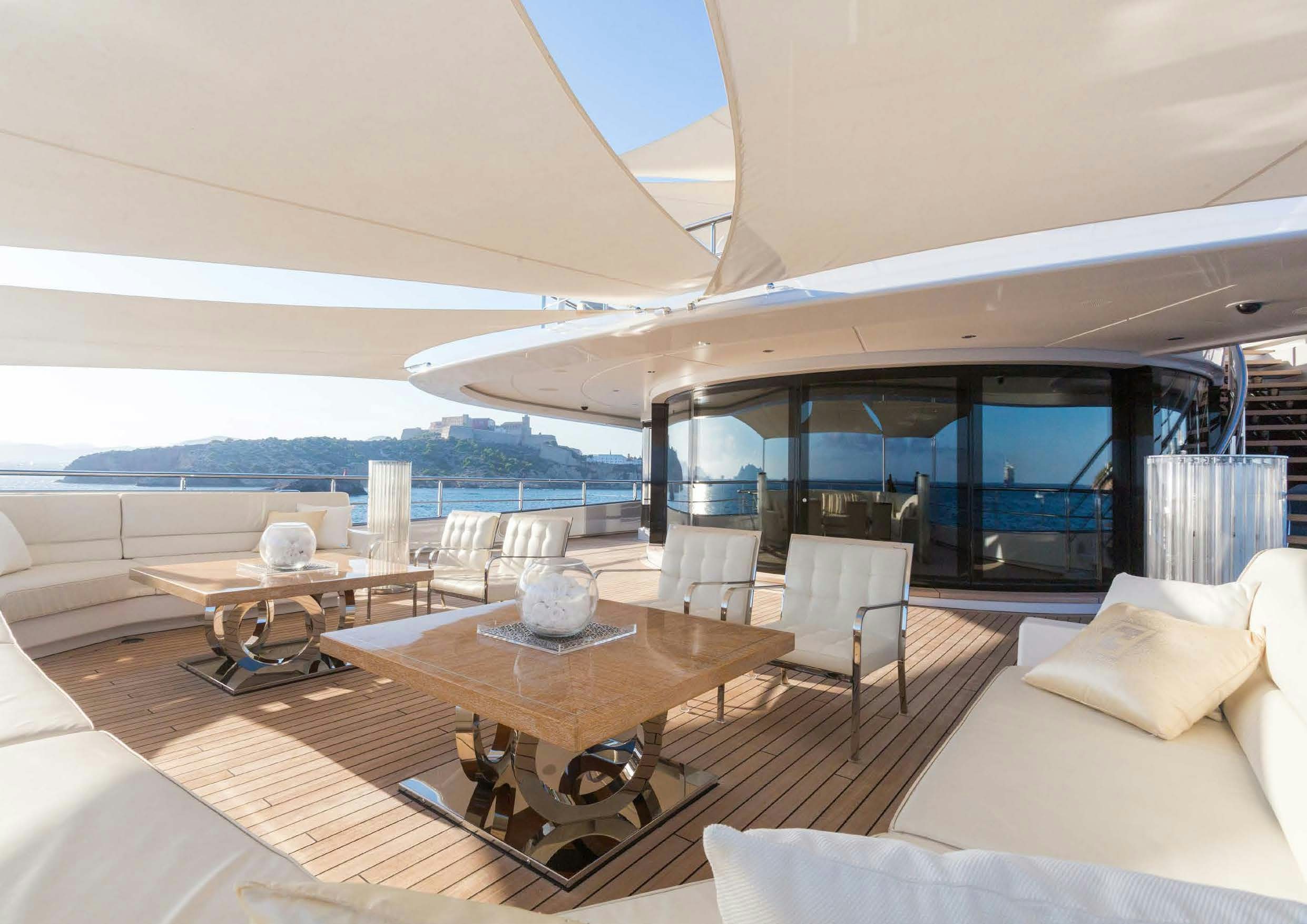 a room with a table and chairs aboard LADY LARA Yacht for Sale