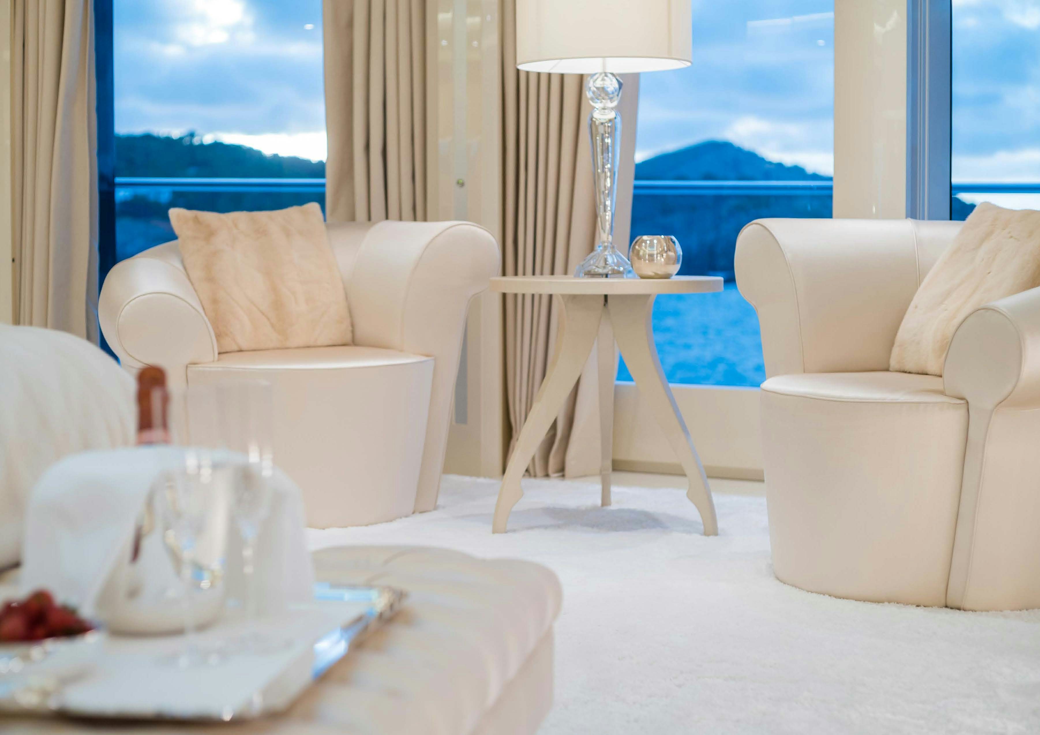 a room with a table and chairs aboard LADY LARA Yacht for Sale