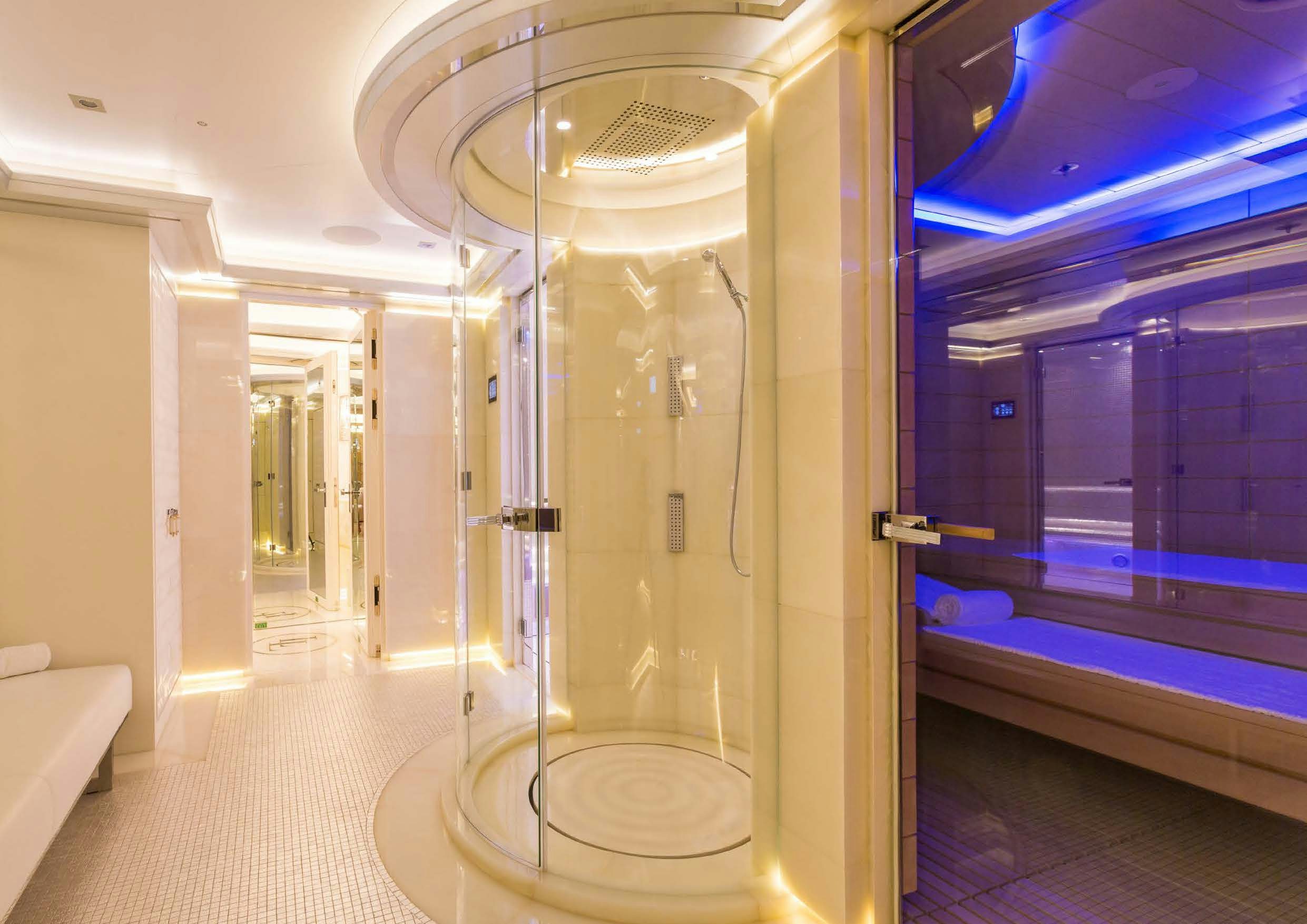 a bathroom with a glass shower aboard LADY LARA Yacht for Sale