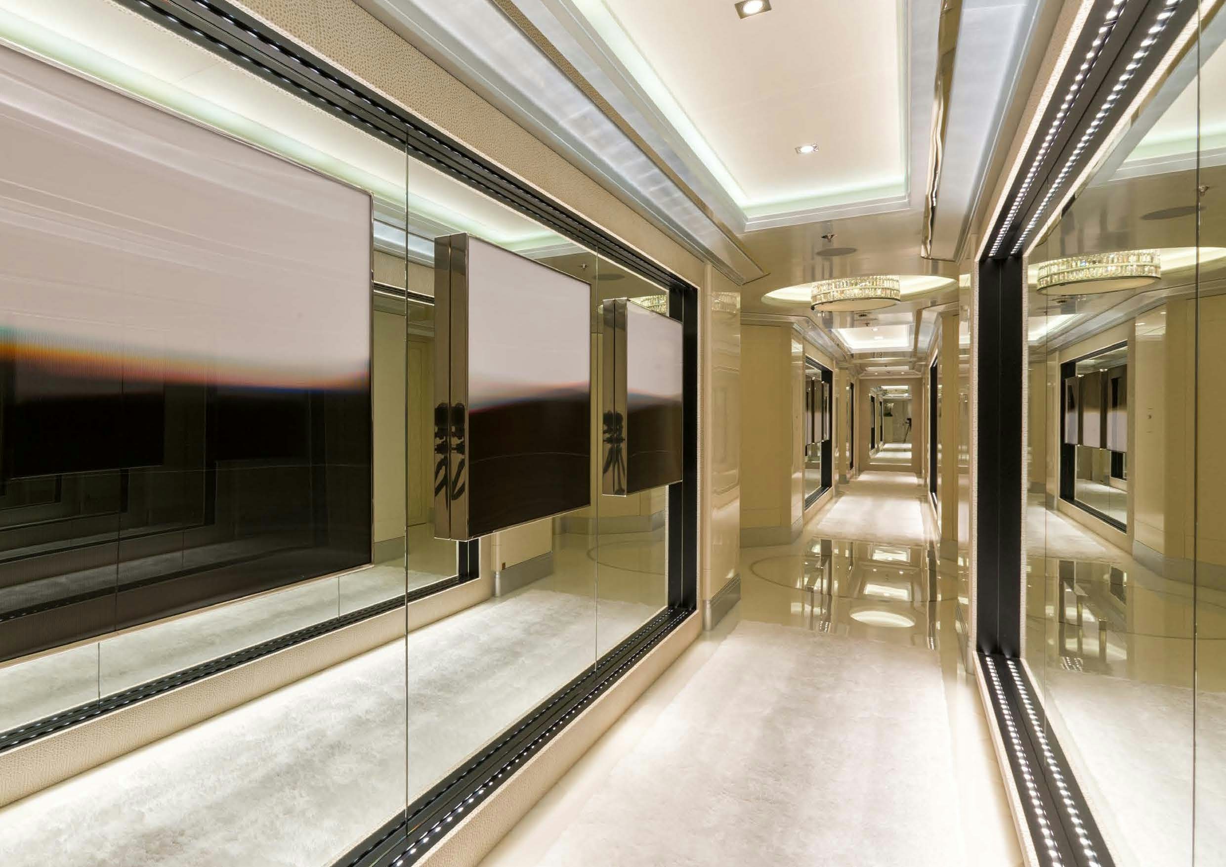 a hallway with glass doors aboard LADY LARA Yacht for Sale