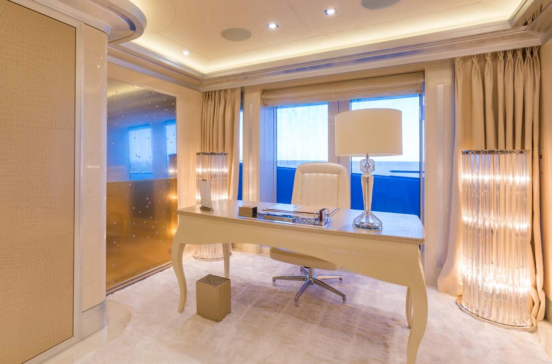 a room with a table and chairs aboard LADY LARA Yacht for Sale