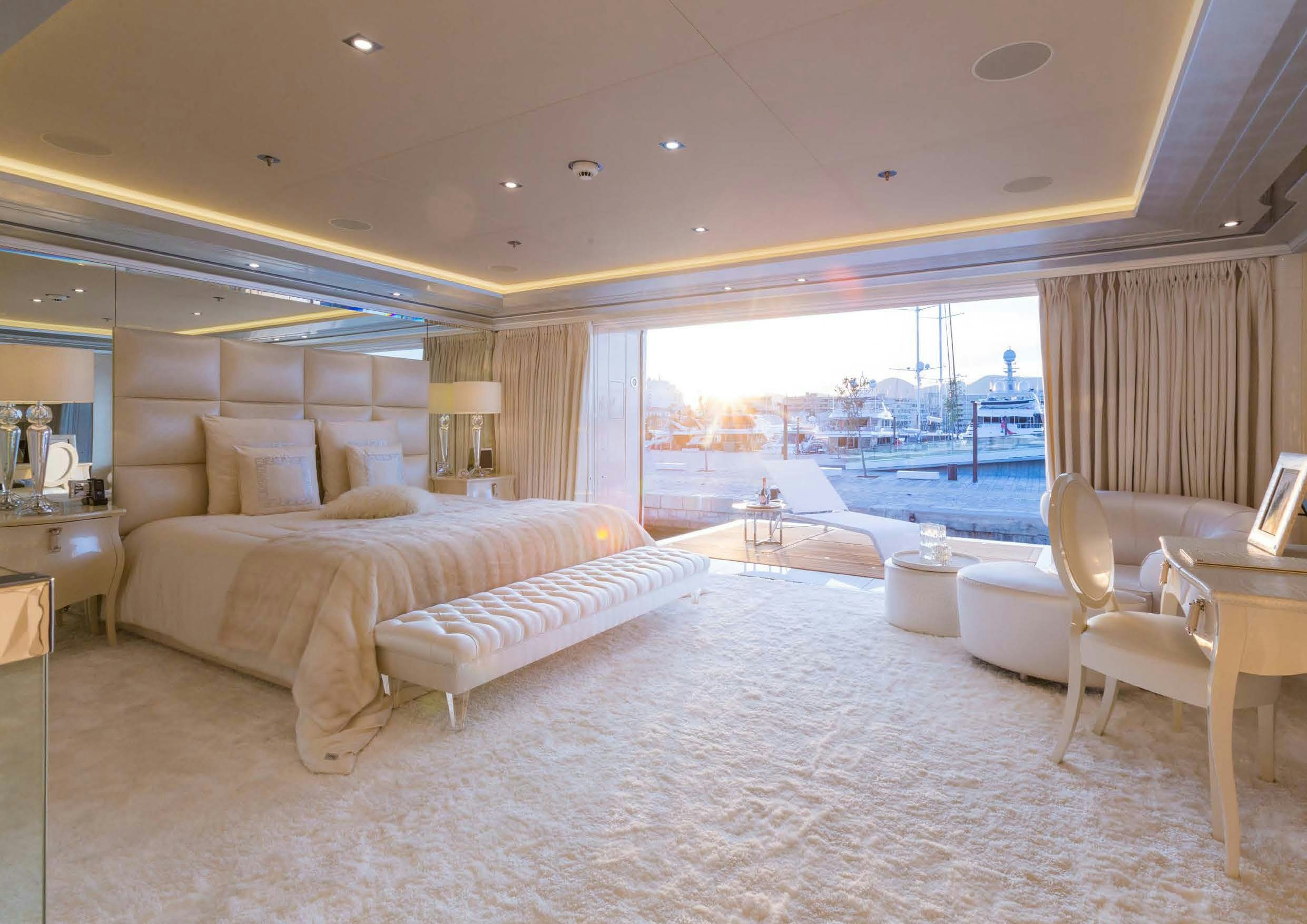 a large hotel room with a large bed and a large window aboard LADY LARA Yacht for Sale