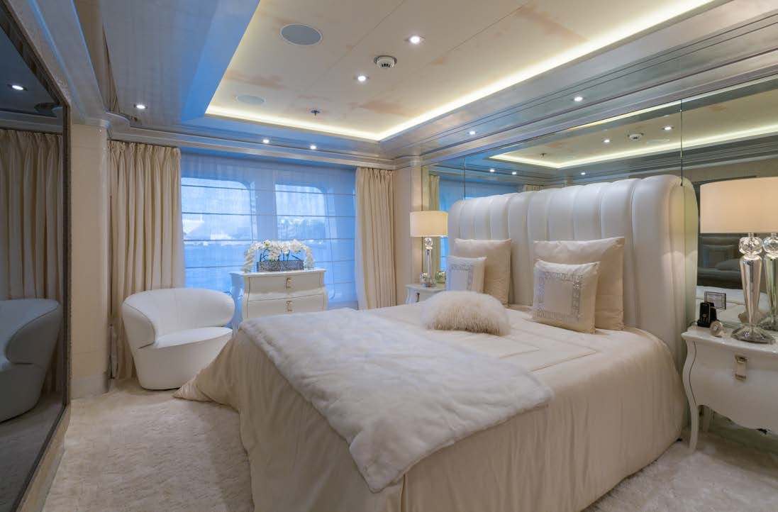a large bed in a room aboard LADY LARA Yacht for Sale