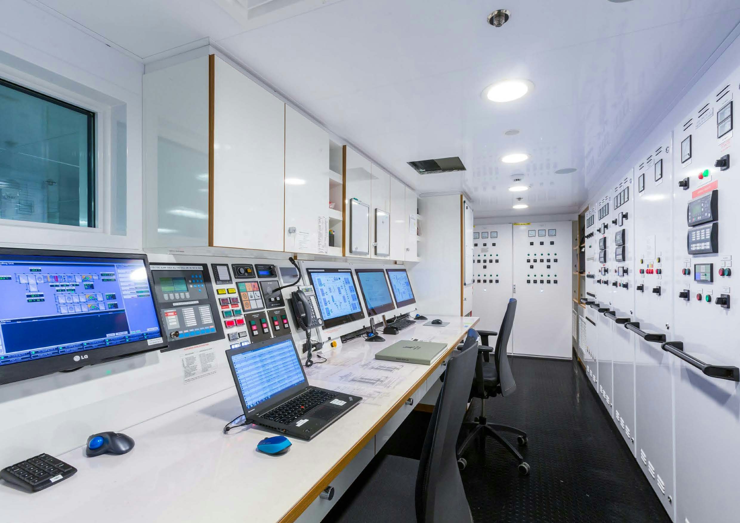 a room with computers and monitors aboard LADY LARA Yacht for Sale