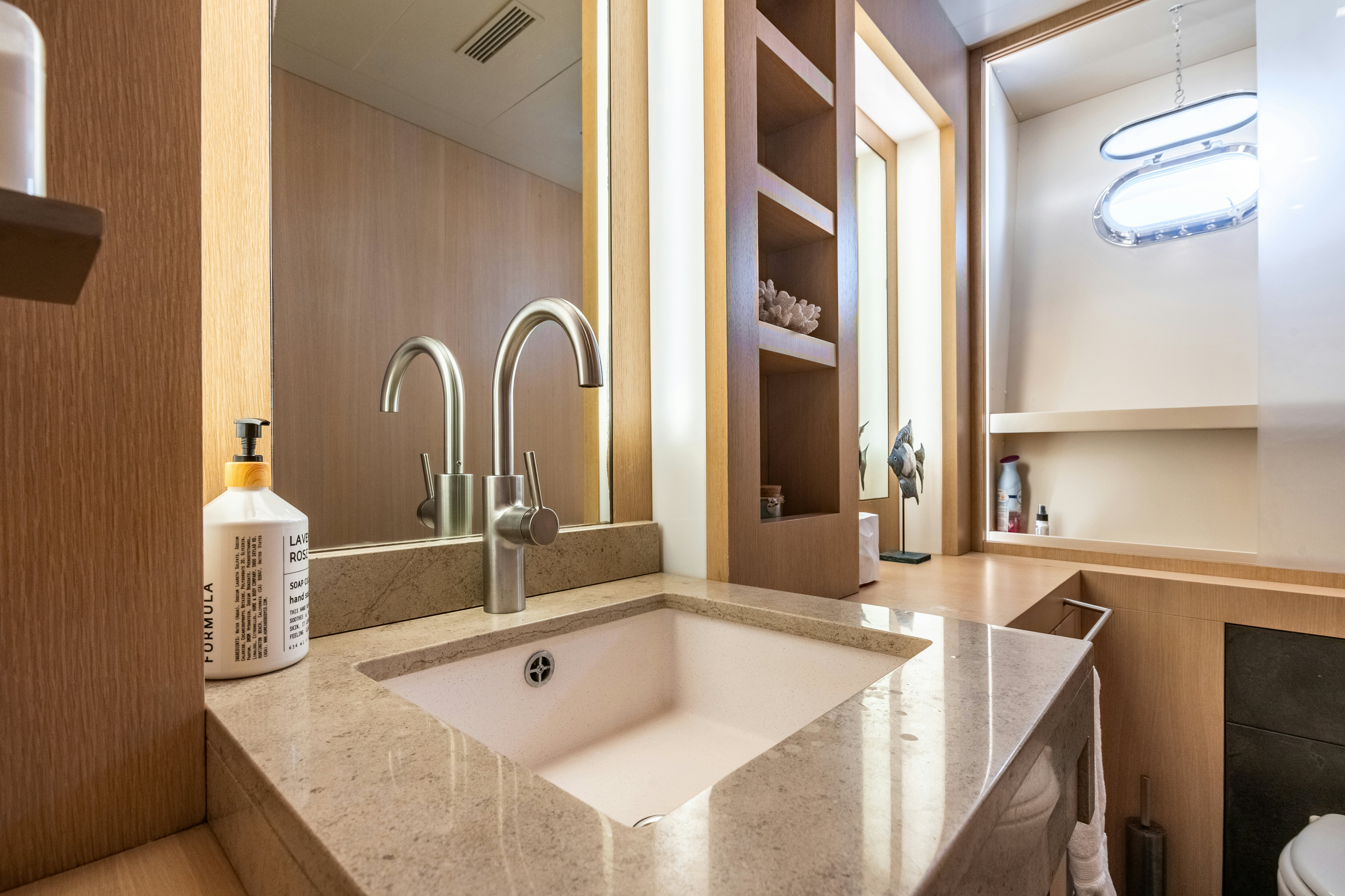 a bathroom with a large sink aboard TOTAL Yacht for Sale