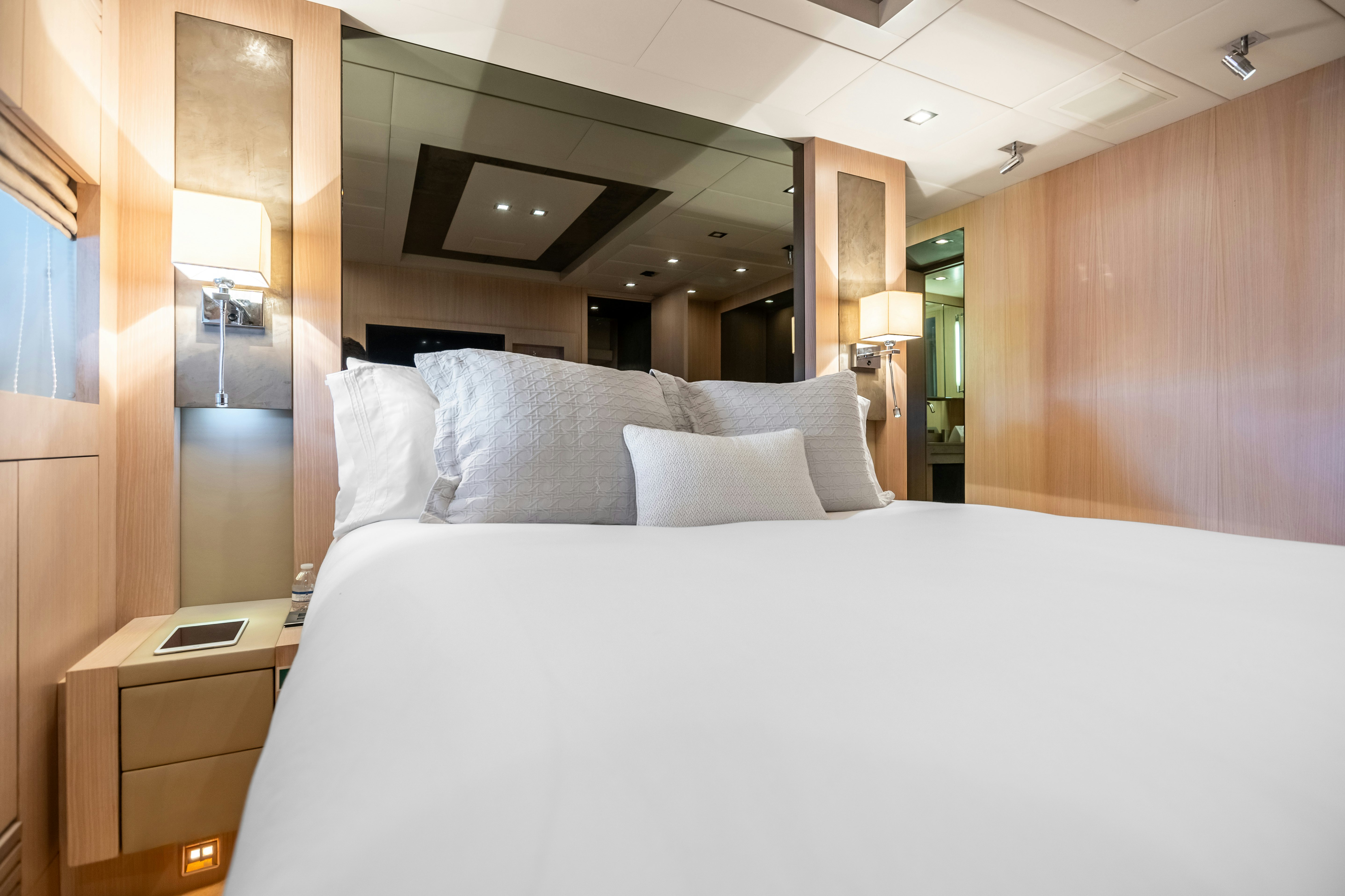 a bed with white sheets aboard TOTAL Yacht for Sale