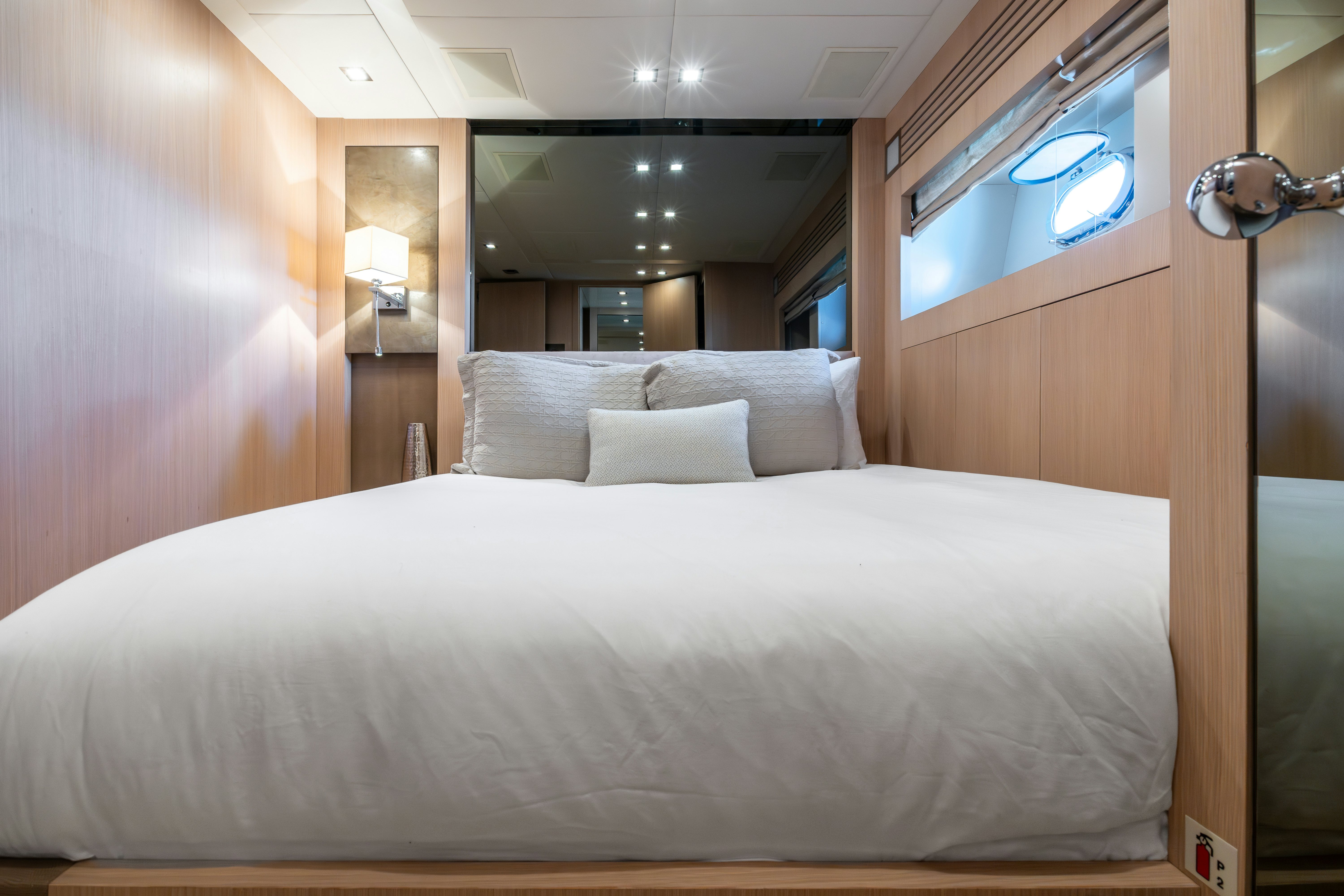 a bed with a white sheet aboard TOTAL Yacht for Sale