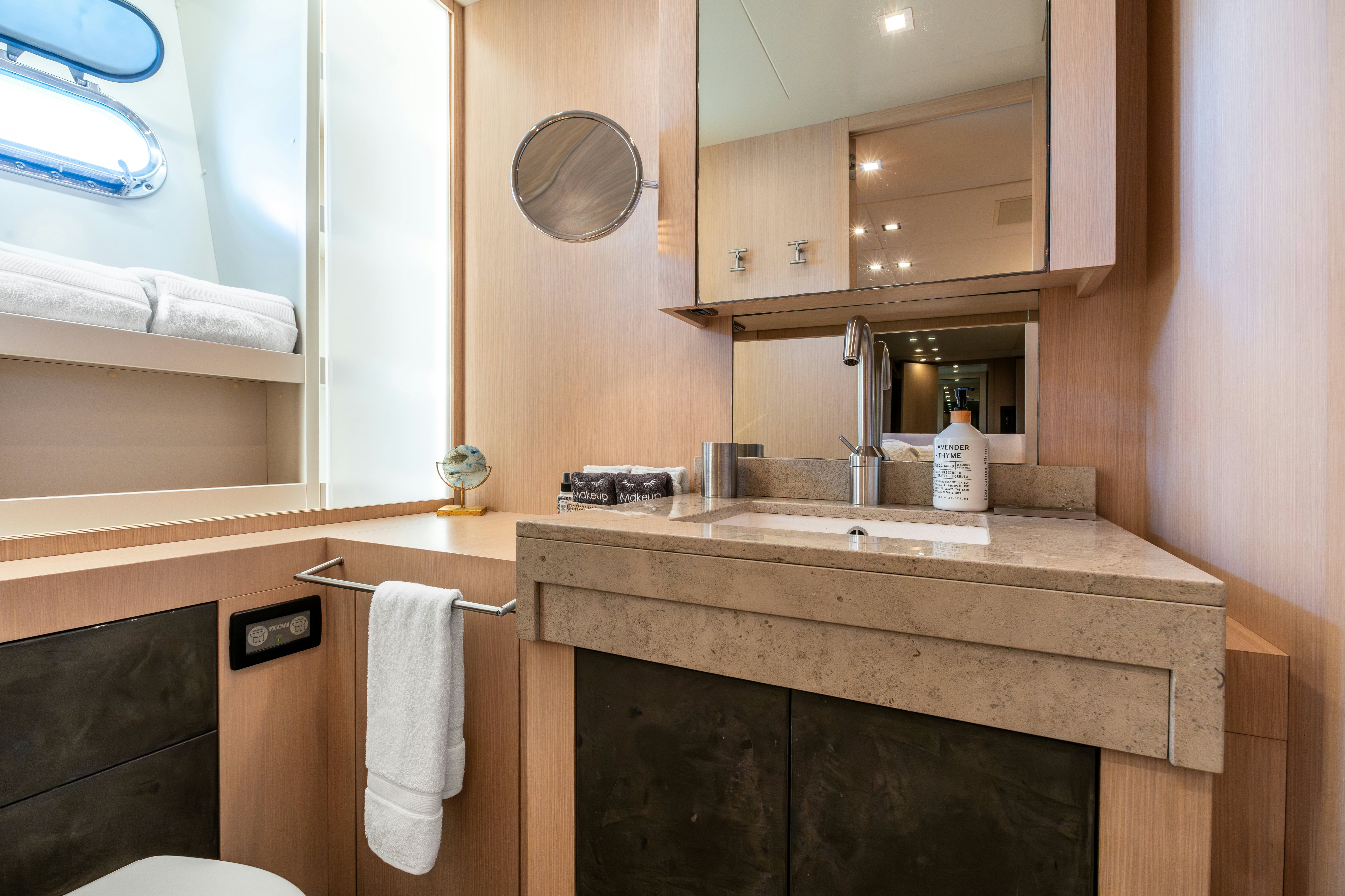 a bathroom with a sink and a mirror aboard TOTAL Yacht for Sale
