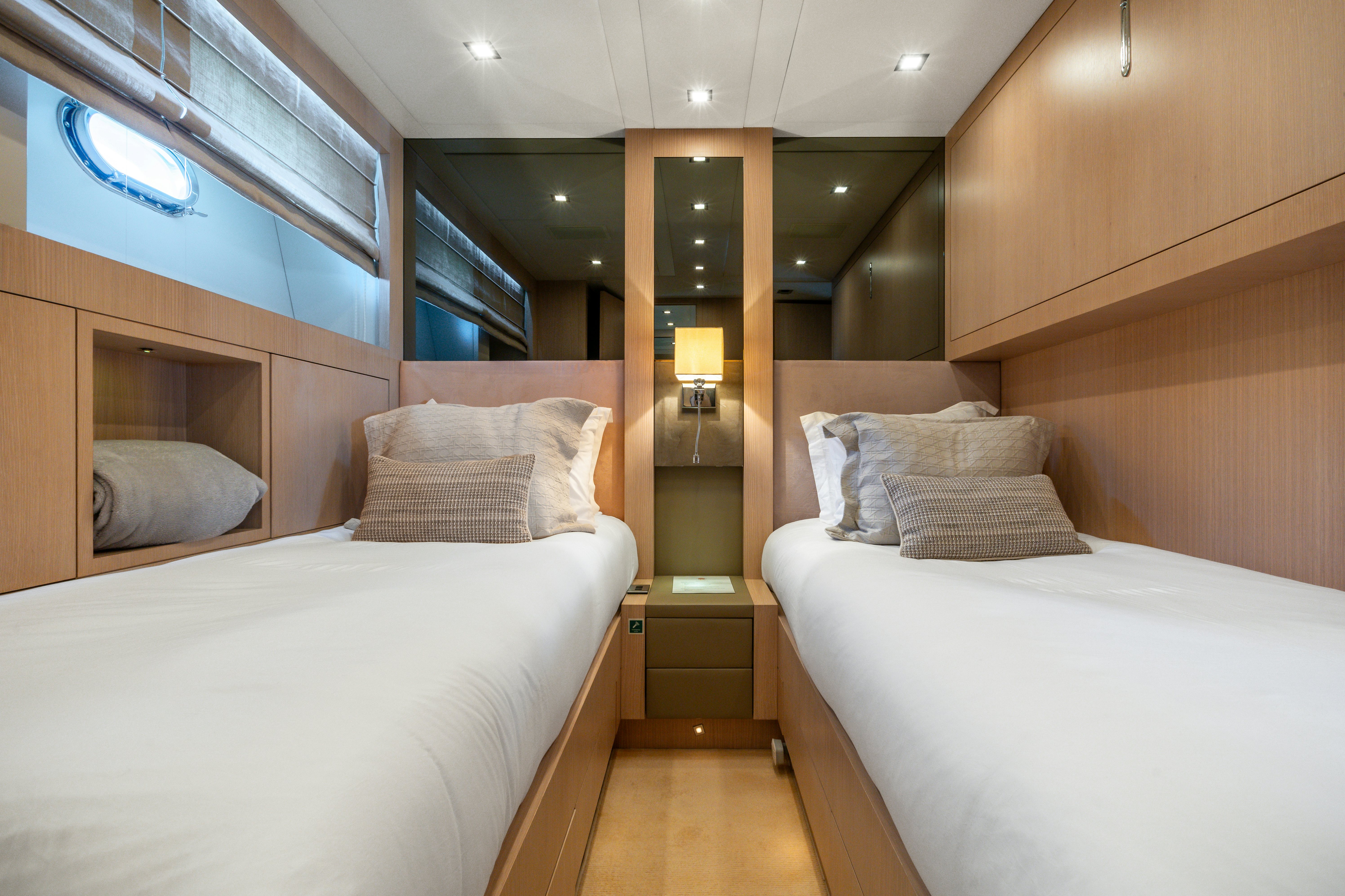 a room with two beds aboard TOTAL Yacht for Sale