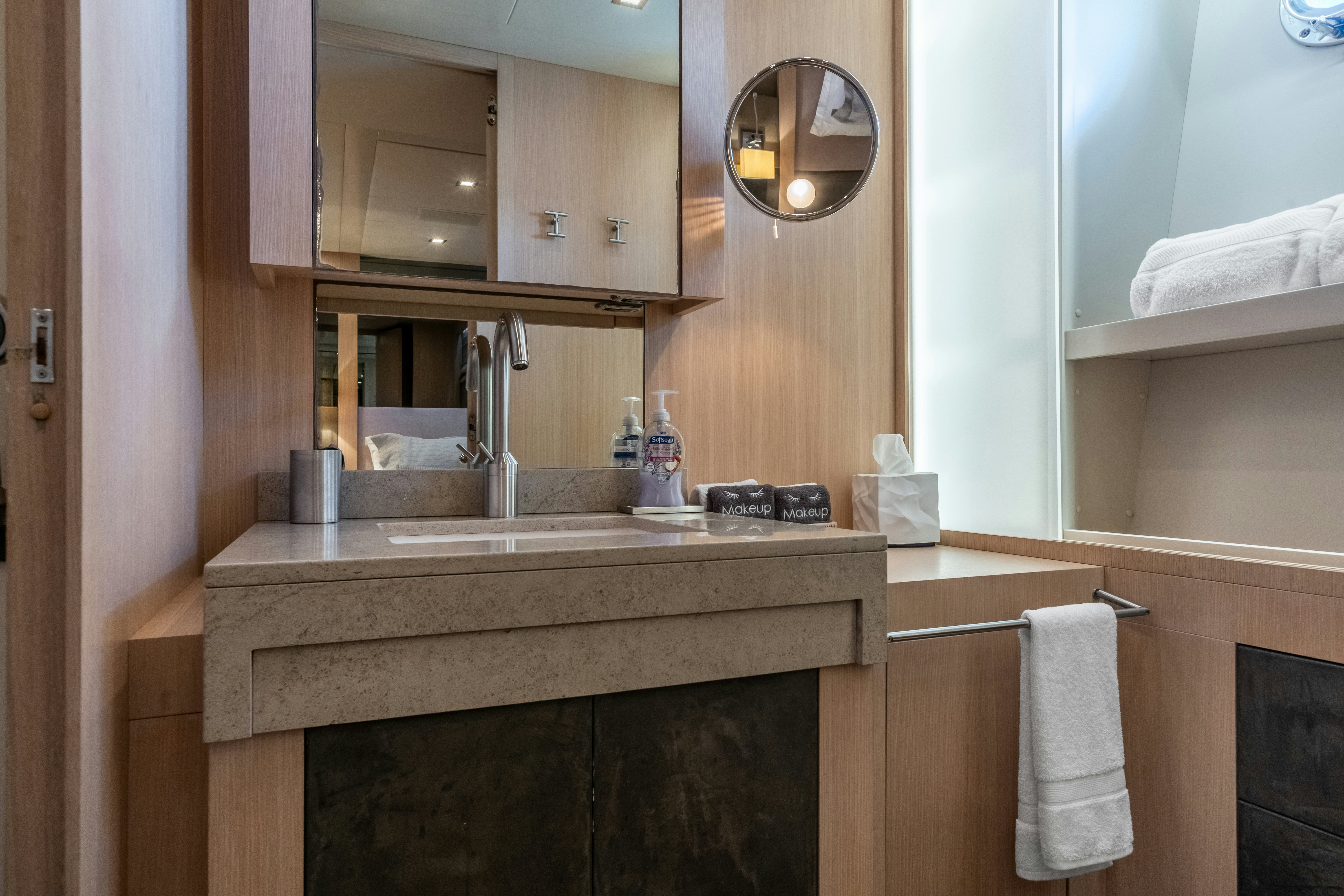 a bathroom with a sink and a mirror aboard TOTAL Yacht for Sale