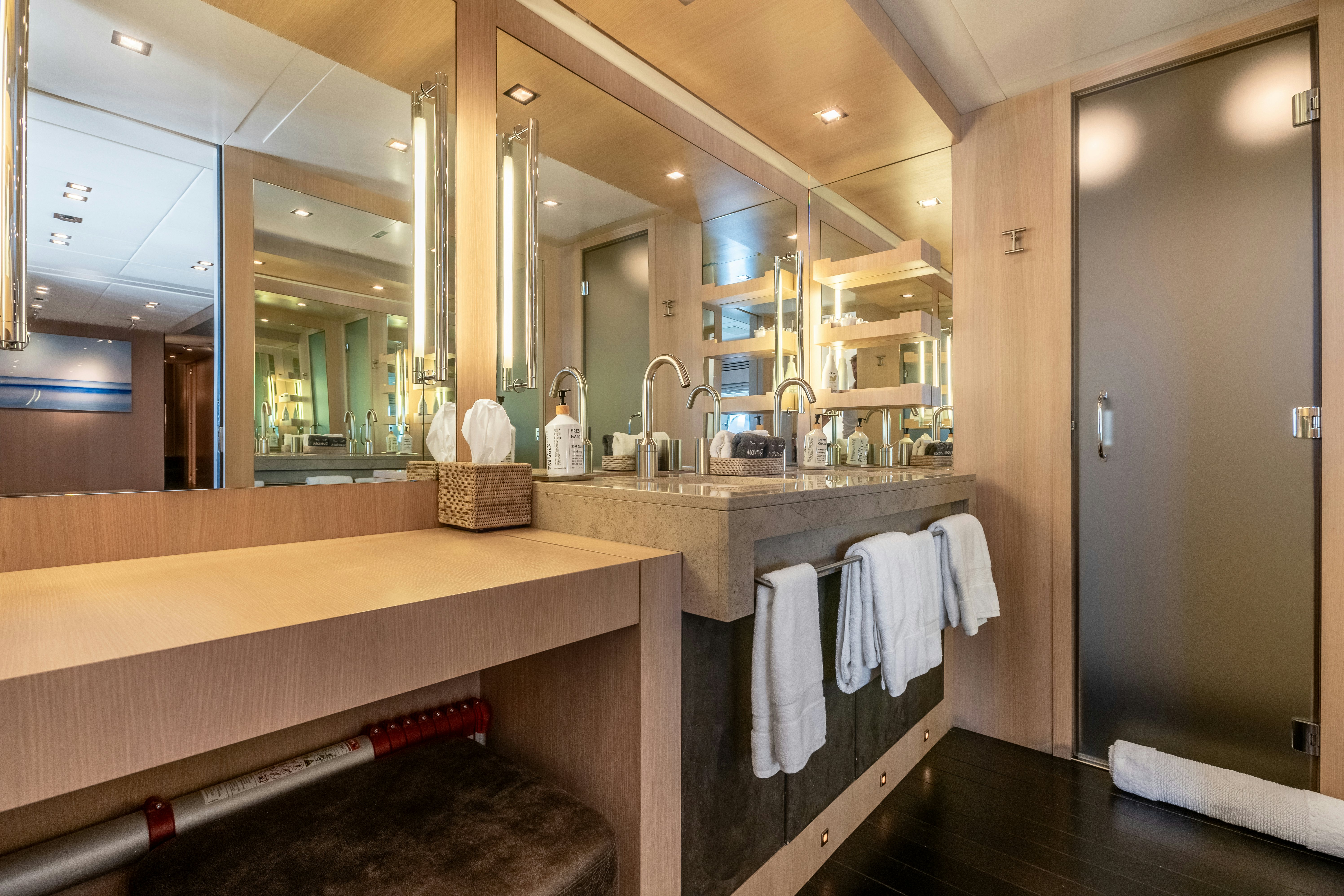 a bathroom with a large mirror aboard TOTAL Yacht for Sale