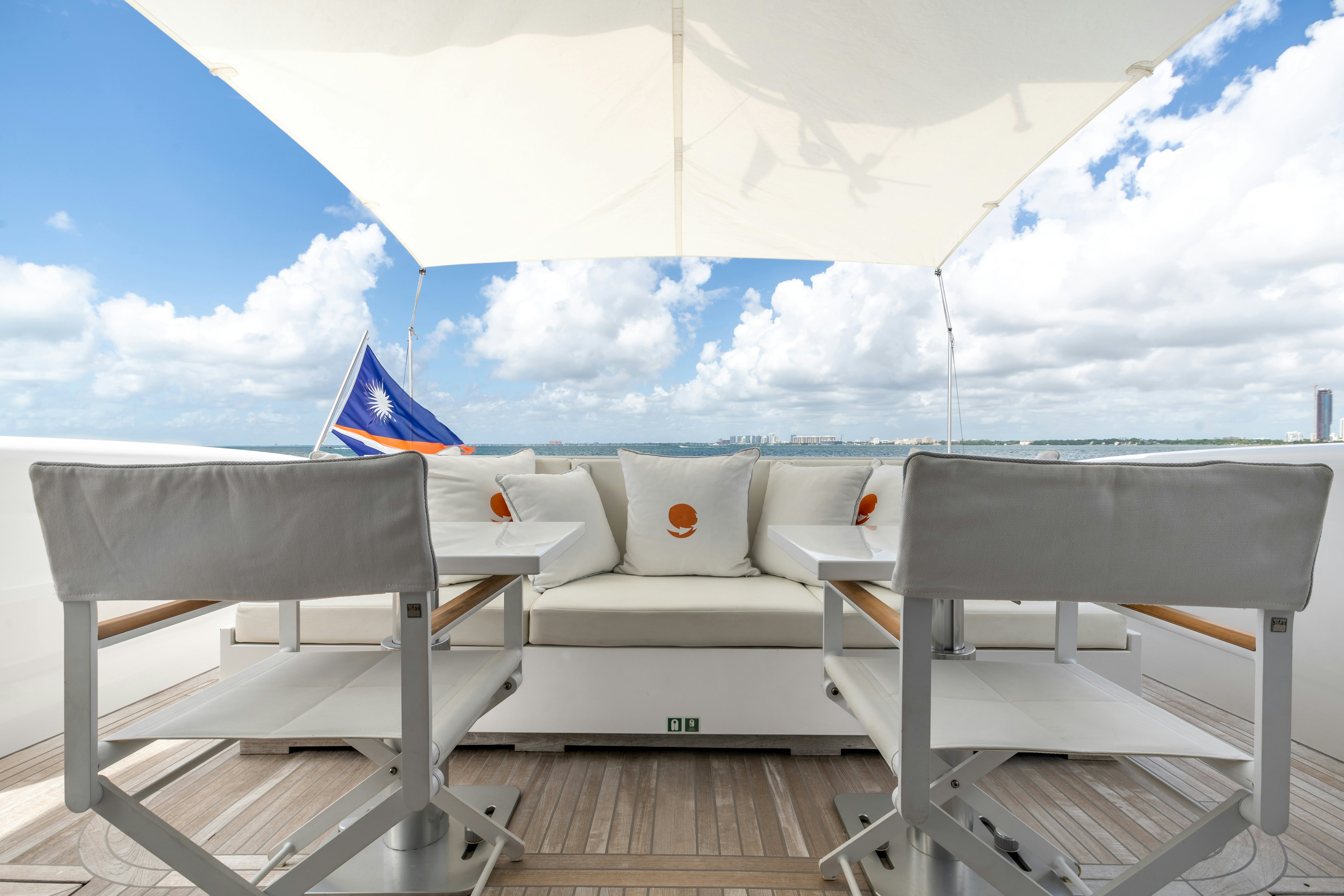 a deck with chairs and a beach aboard TOTAL Yacht for Sale