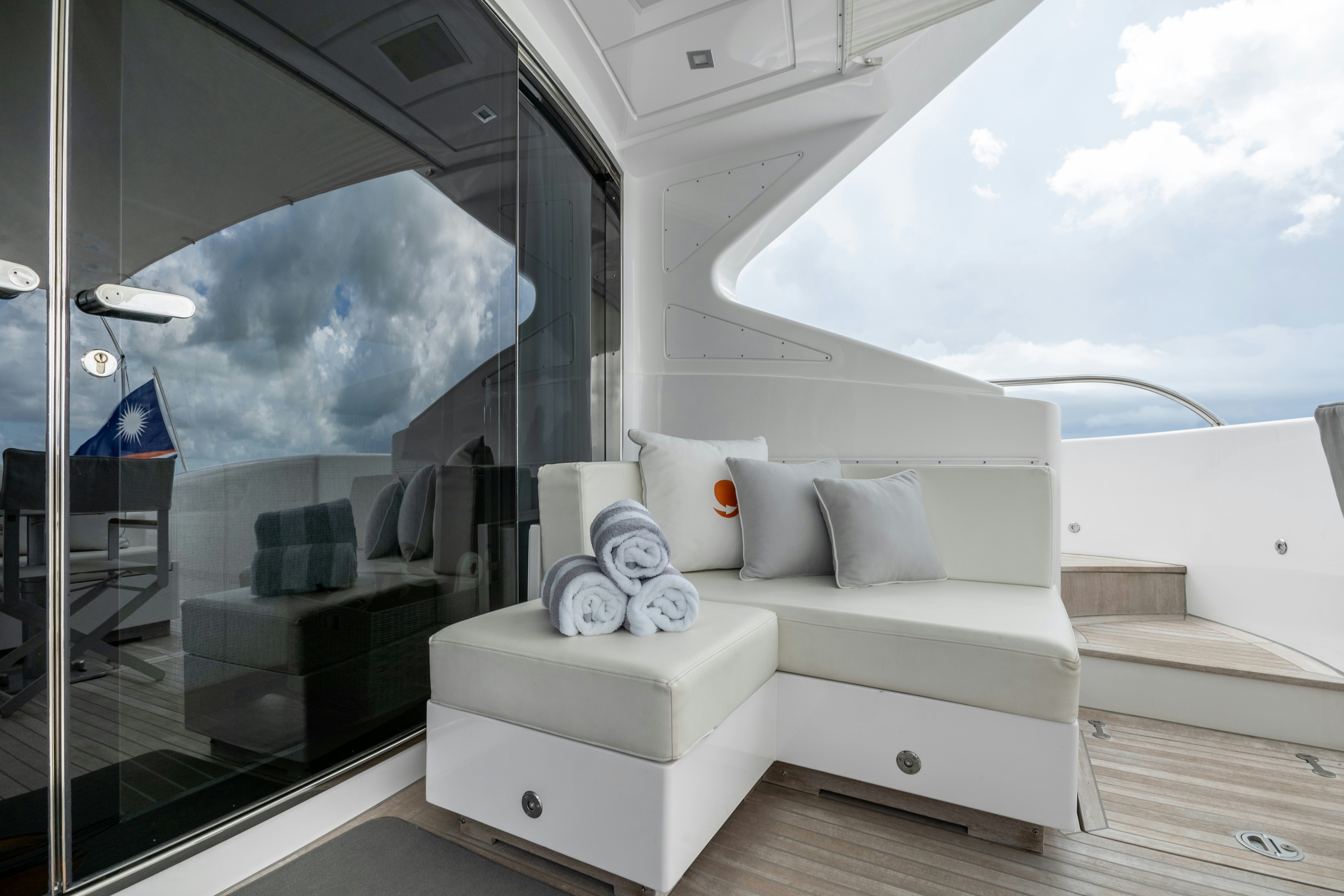 a white couch in a room aboard TOTAL Yacht for Sale