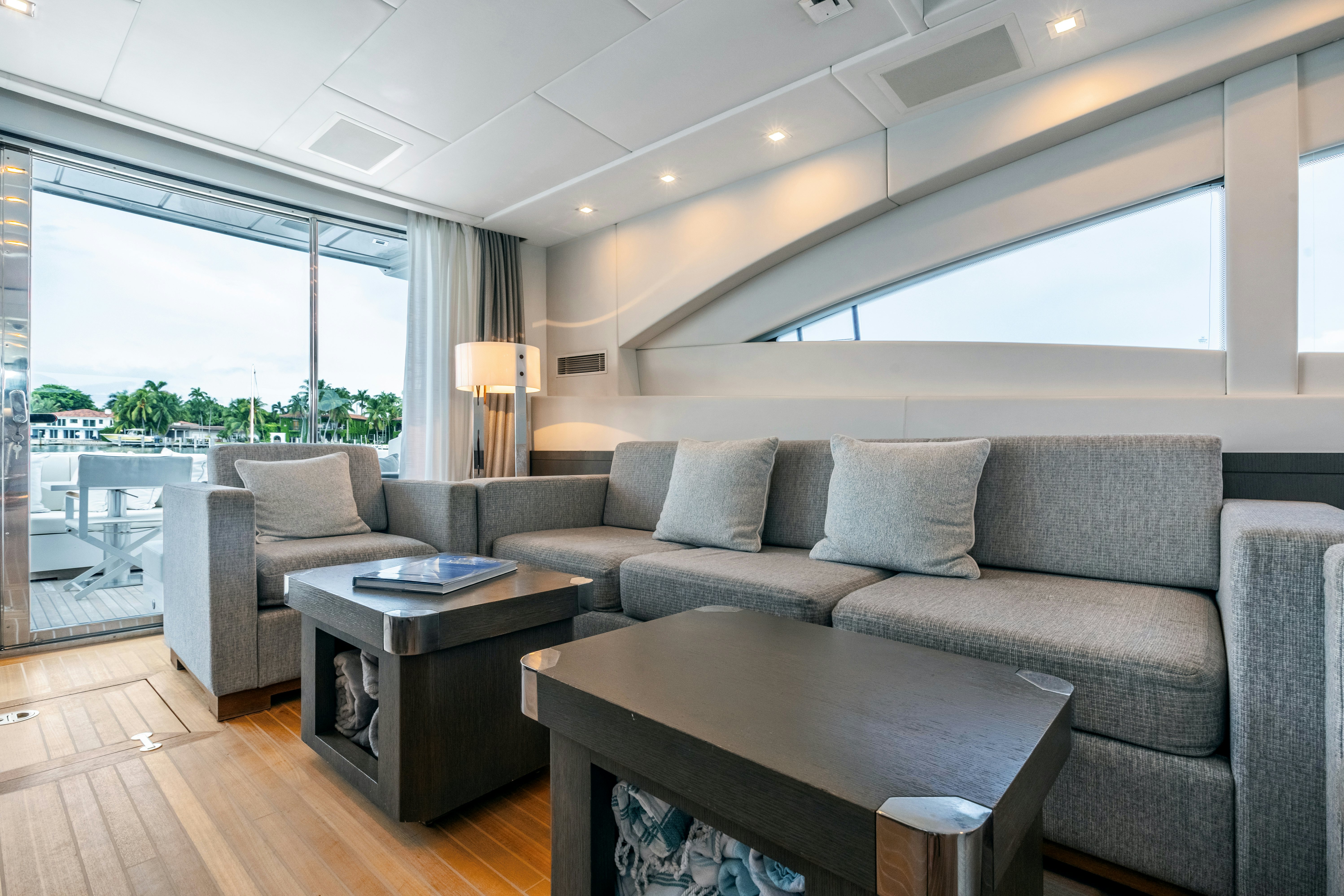 a living room with a couch and a coffee table aboard TOTAL Yacht for Sale