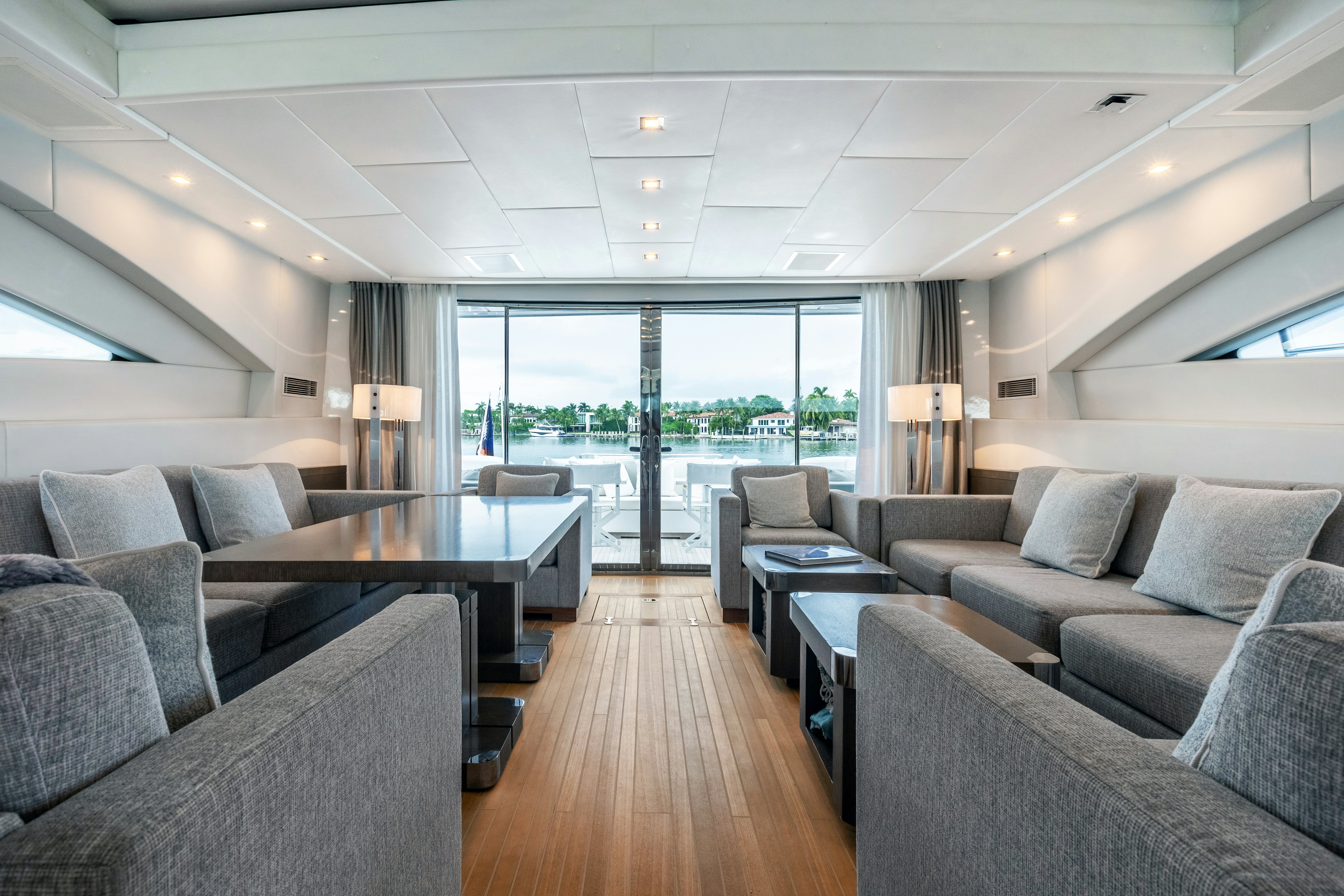 a living room with a large window aboard TOTAL Yacht for Sale