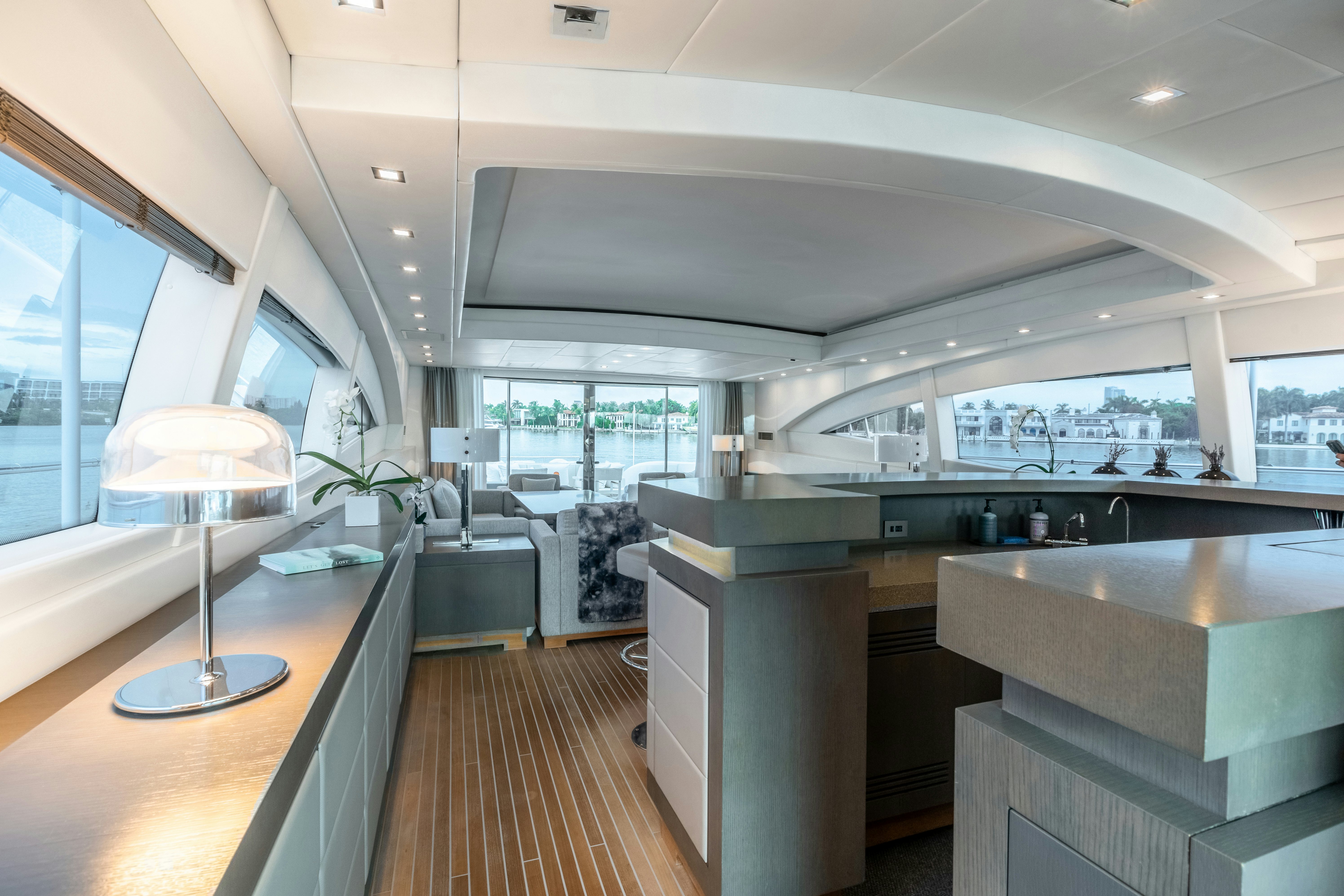 a large room with a large window and a table aboard TOTAL Yacht for Sale