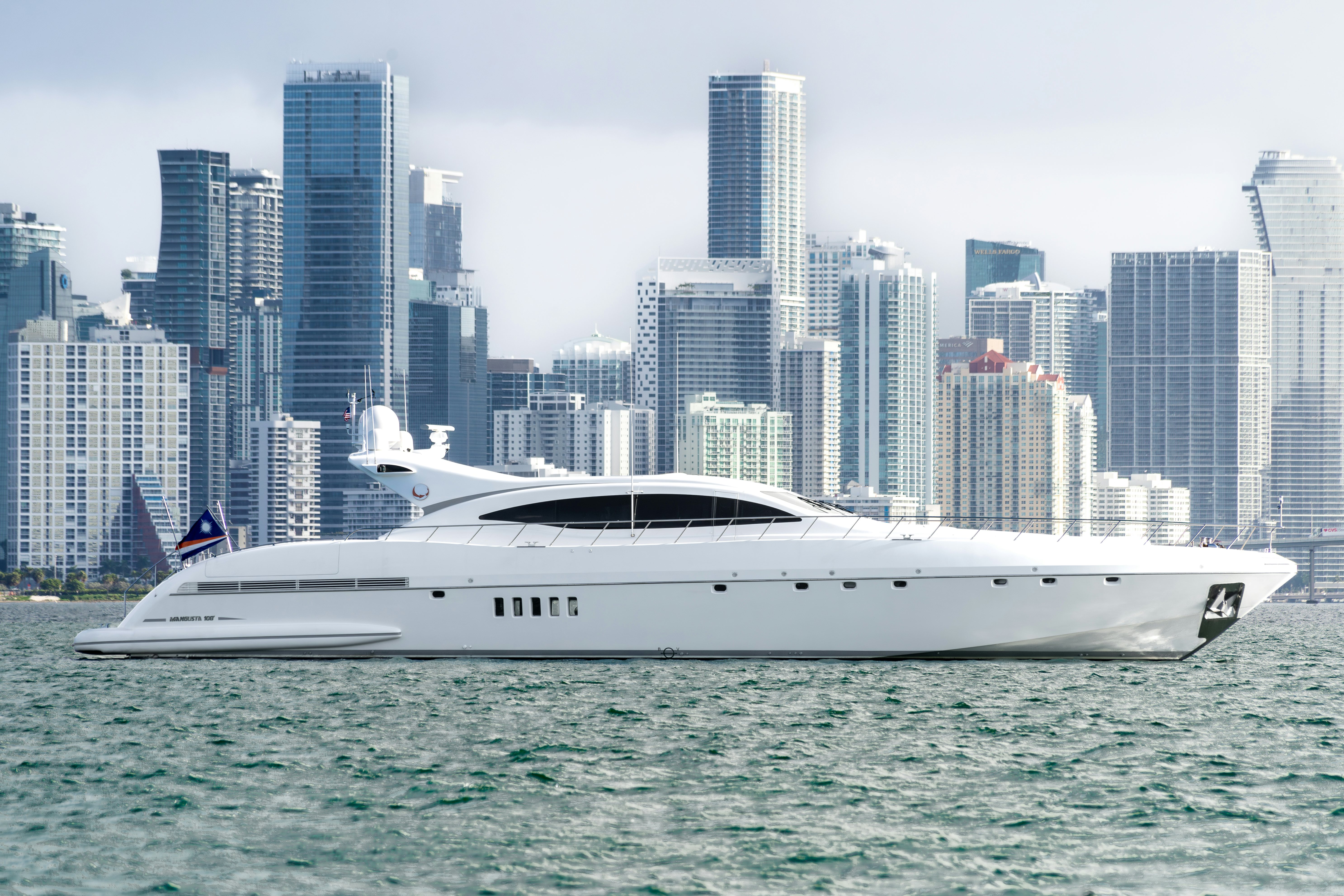 a white yacht in the water aboard TOTAL Yacht for Sale