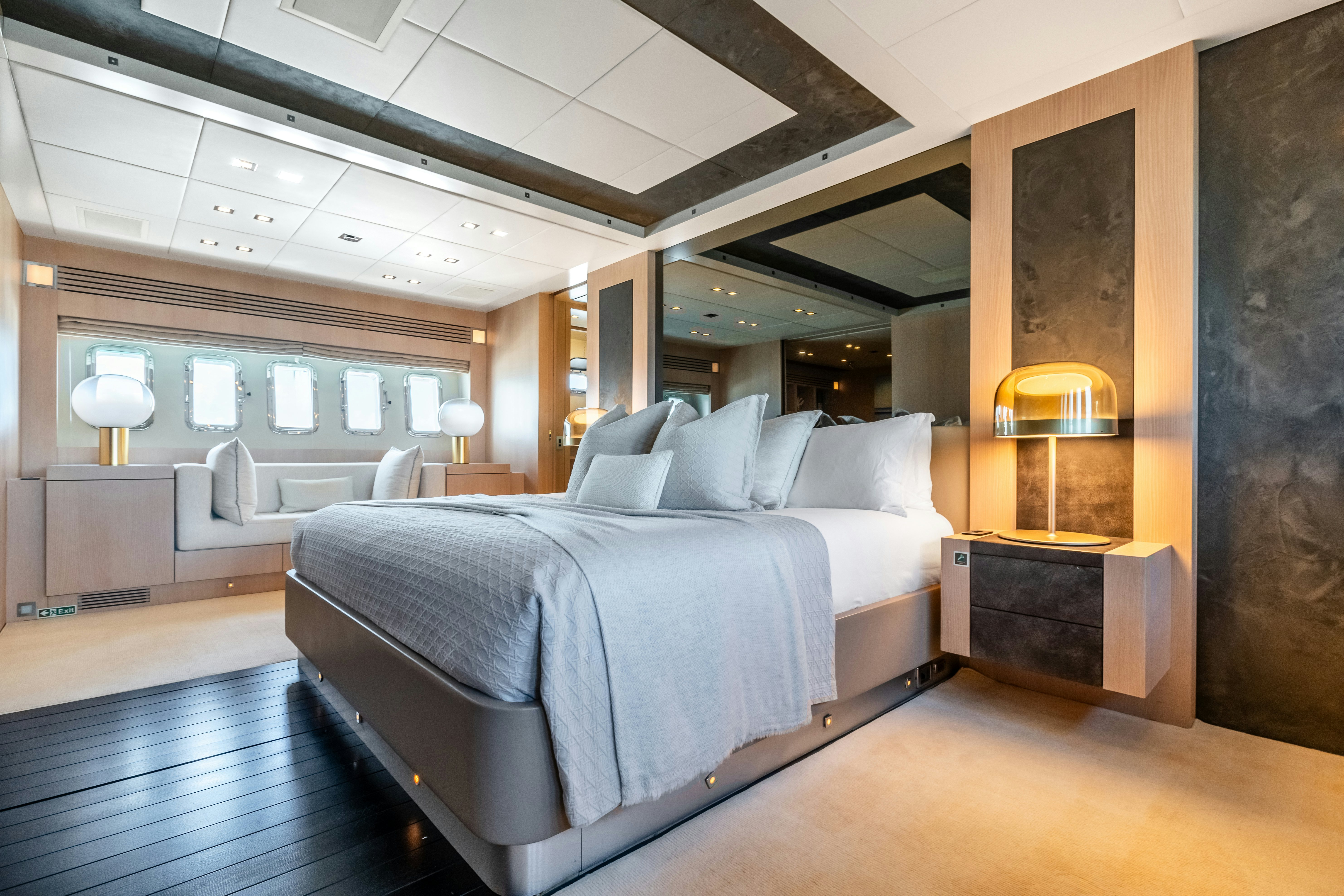 a bedroom with a large bed aboard TOTAL Yacht for Sale