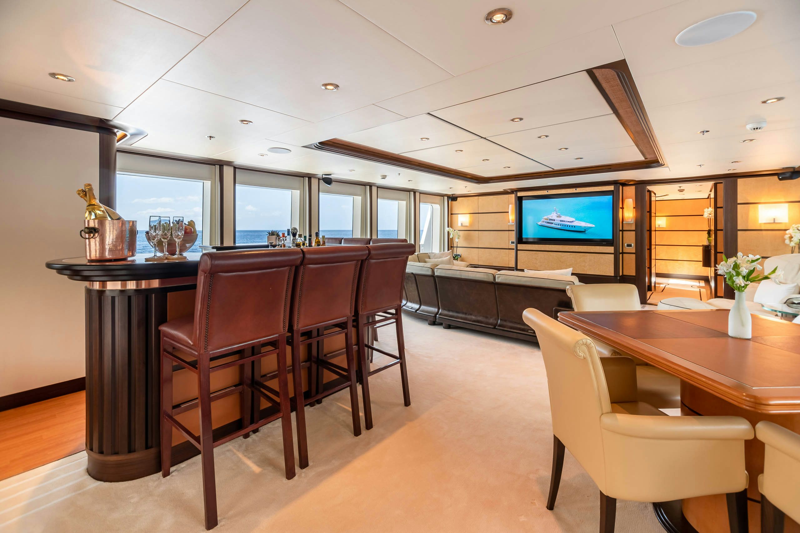 a room with a table and chairs aboard HARLE Yacht for Charter