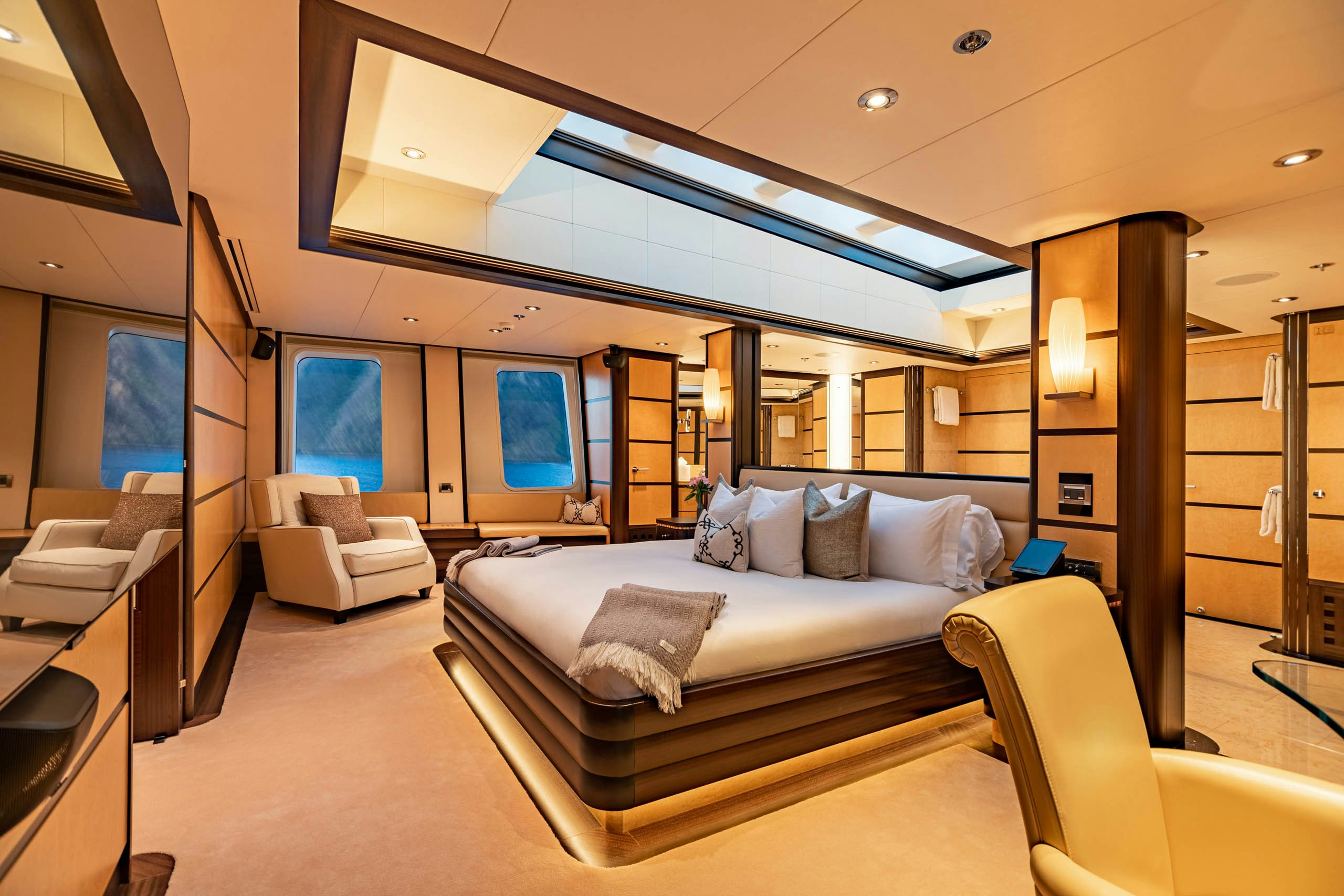 a room with a bed and a couch aboard HARLE Yacht for Charter