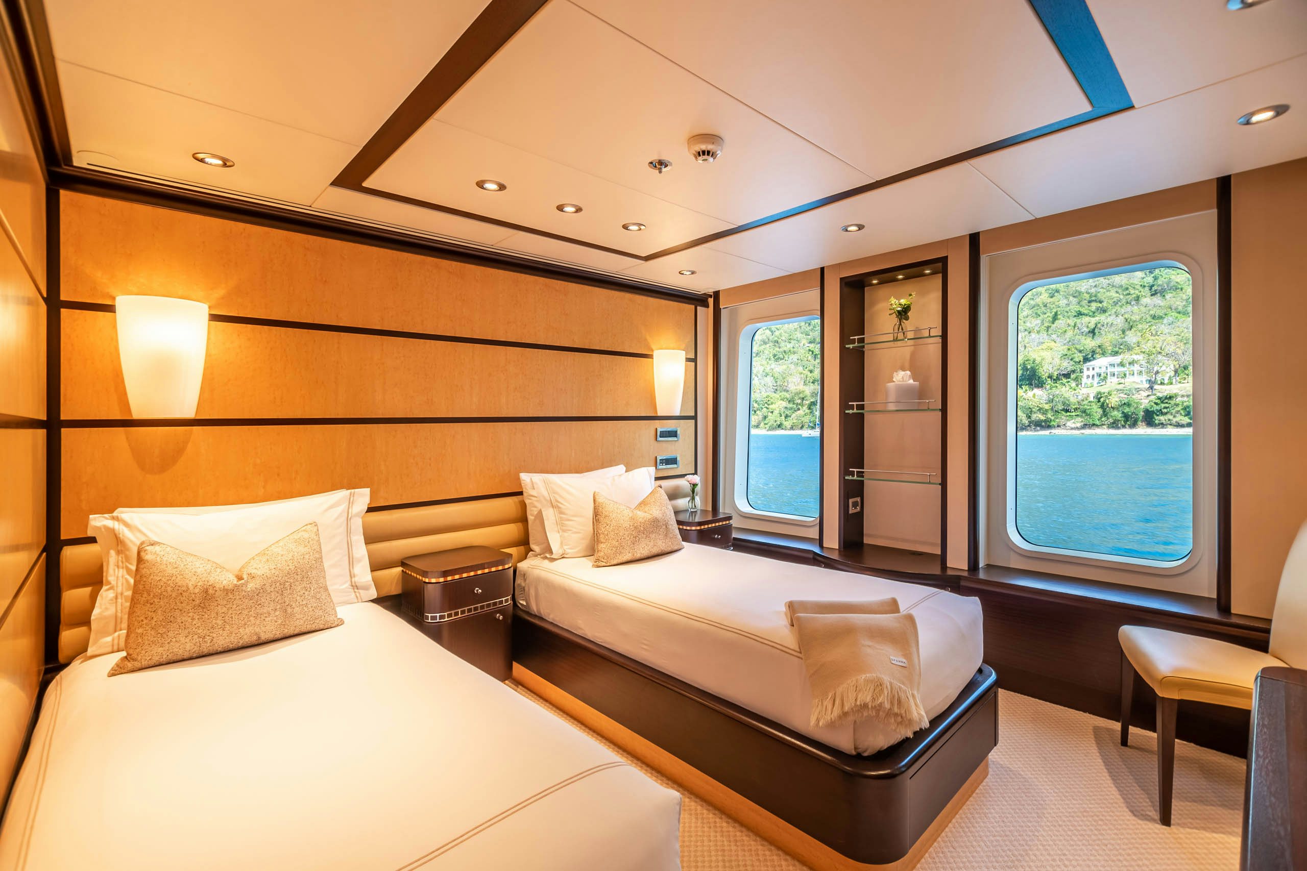 a room with a bed and a window aboard HARLE Yacht for Charter