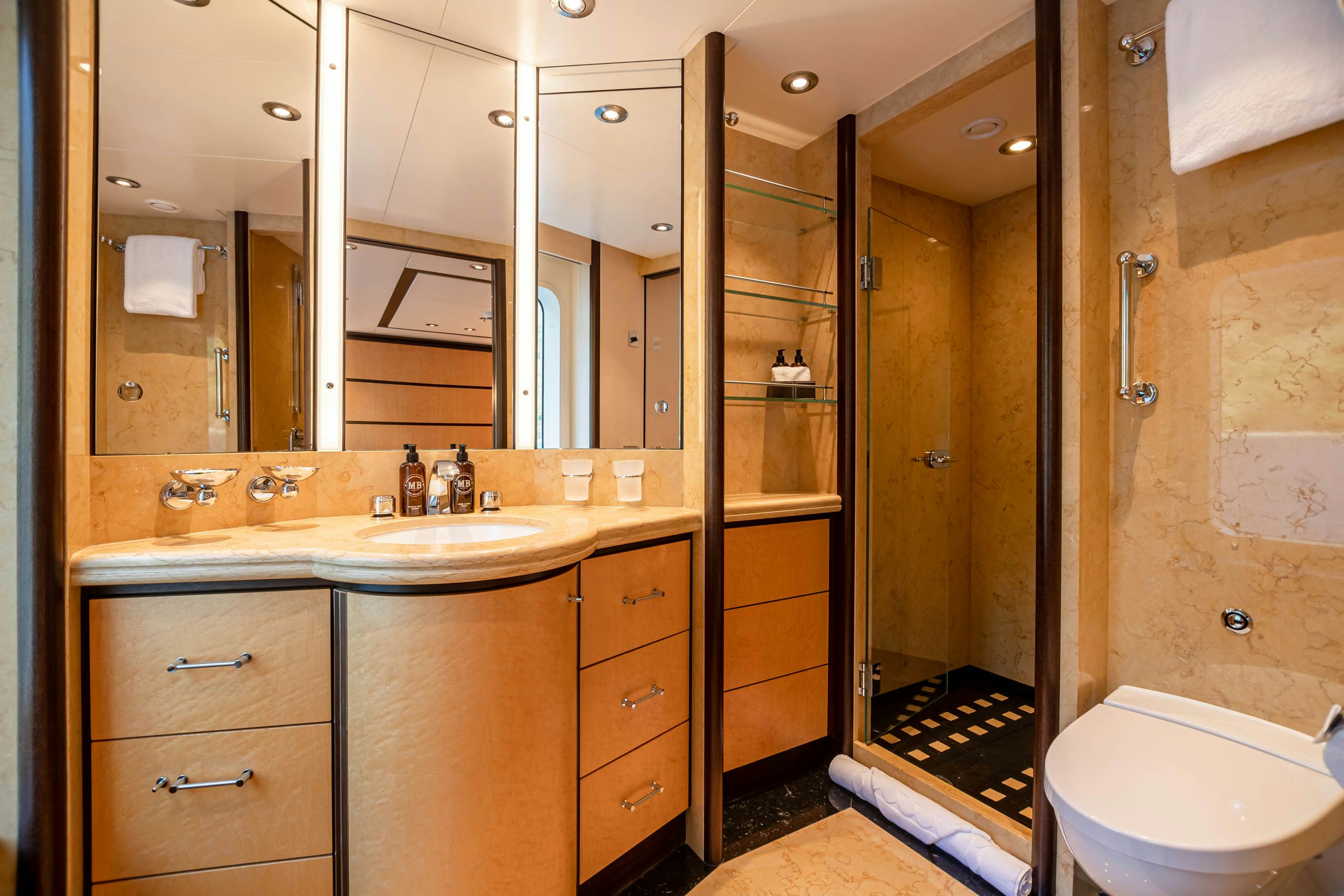 a bathroom with a sink and a mirror aboard HARLE Yacht for Charter