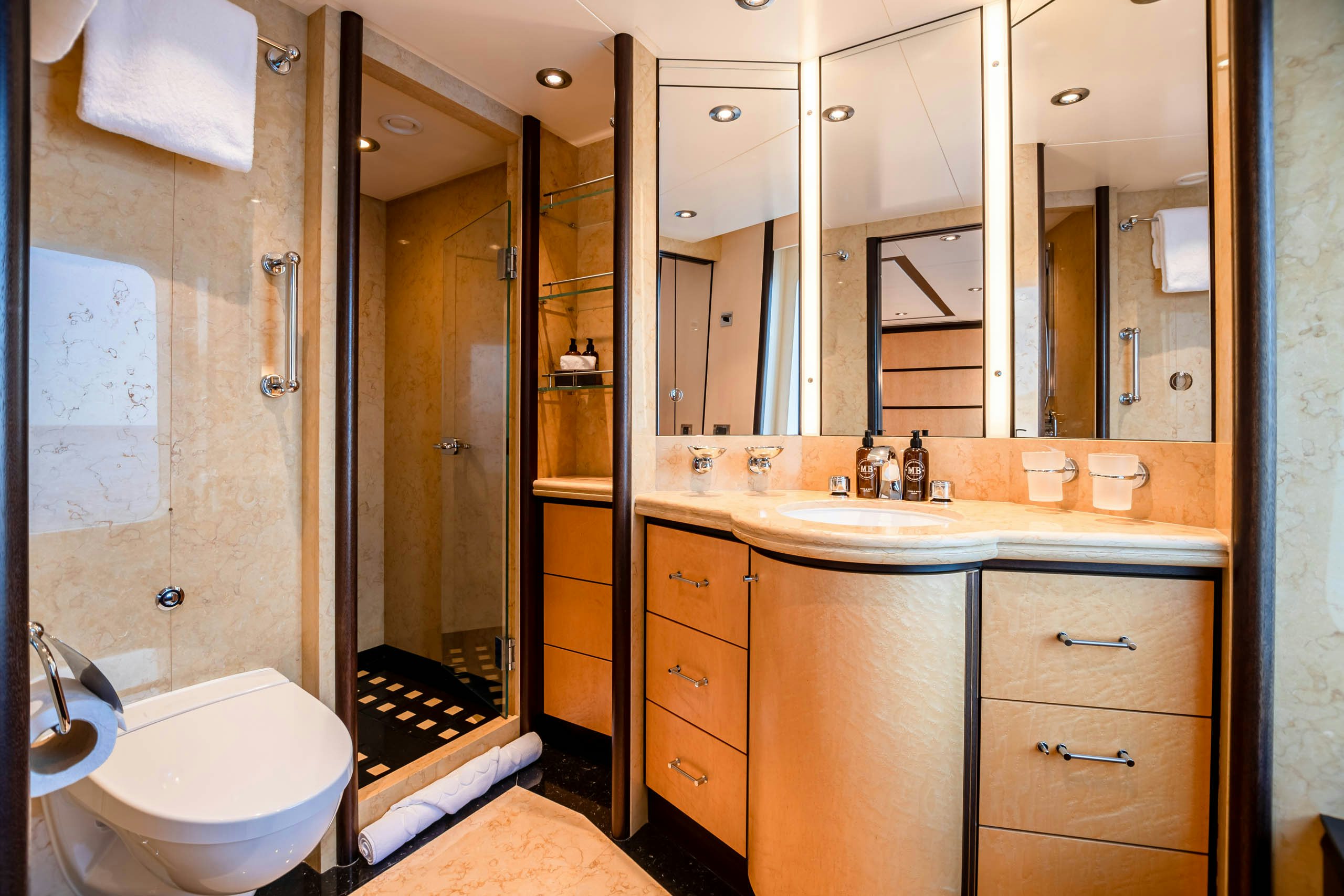 a bathroom with a large mirror aboard HARLE Yacht for Charter