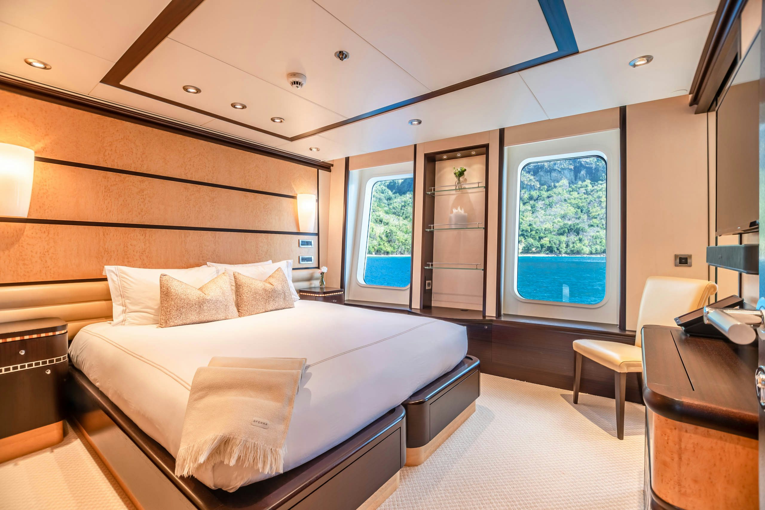a room with a bed and a desk aboard HARLE Yacht for Charter