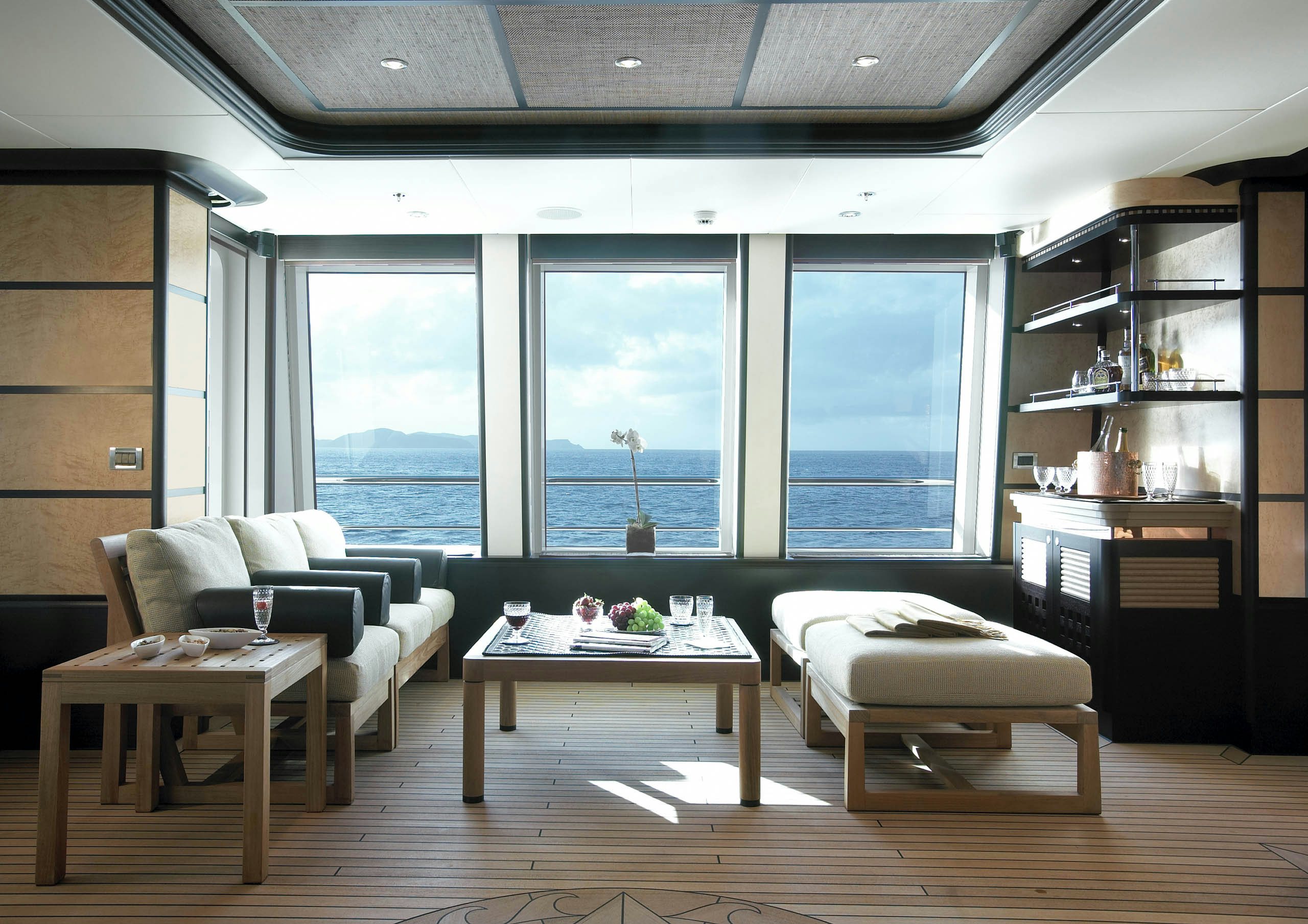 a room with a table and couches aboard HARLE Yacht for Charter