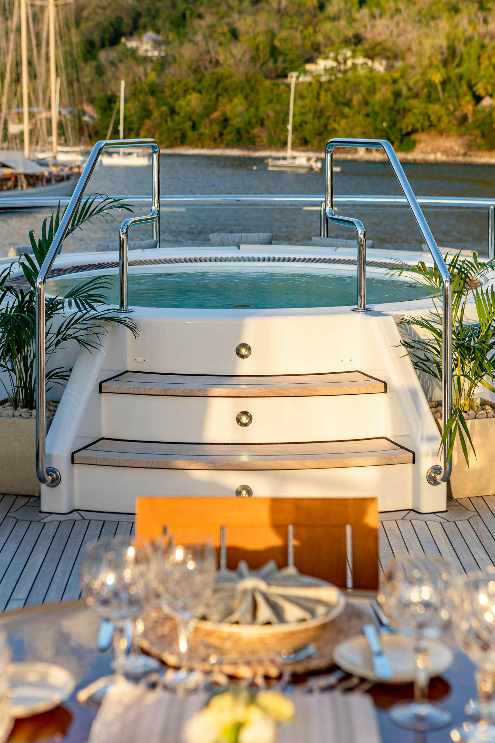 a white rectangular object with a basket on a table with a basket of food and a basket of aboard HARLE Yacht for Charter