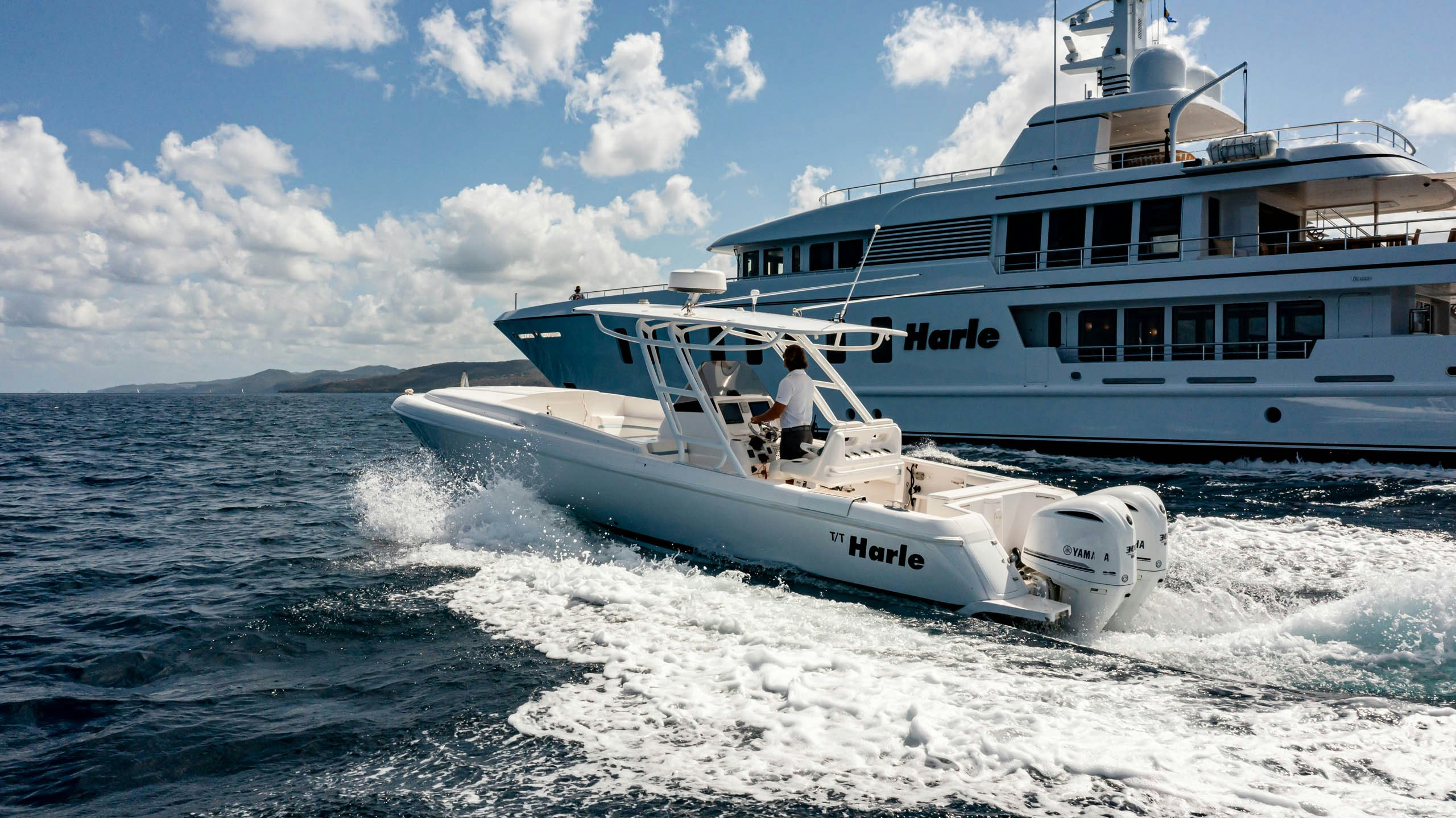 a white boat on the water aboard HARLE Yacht for Charter