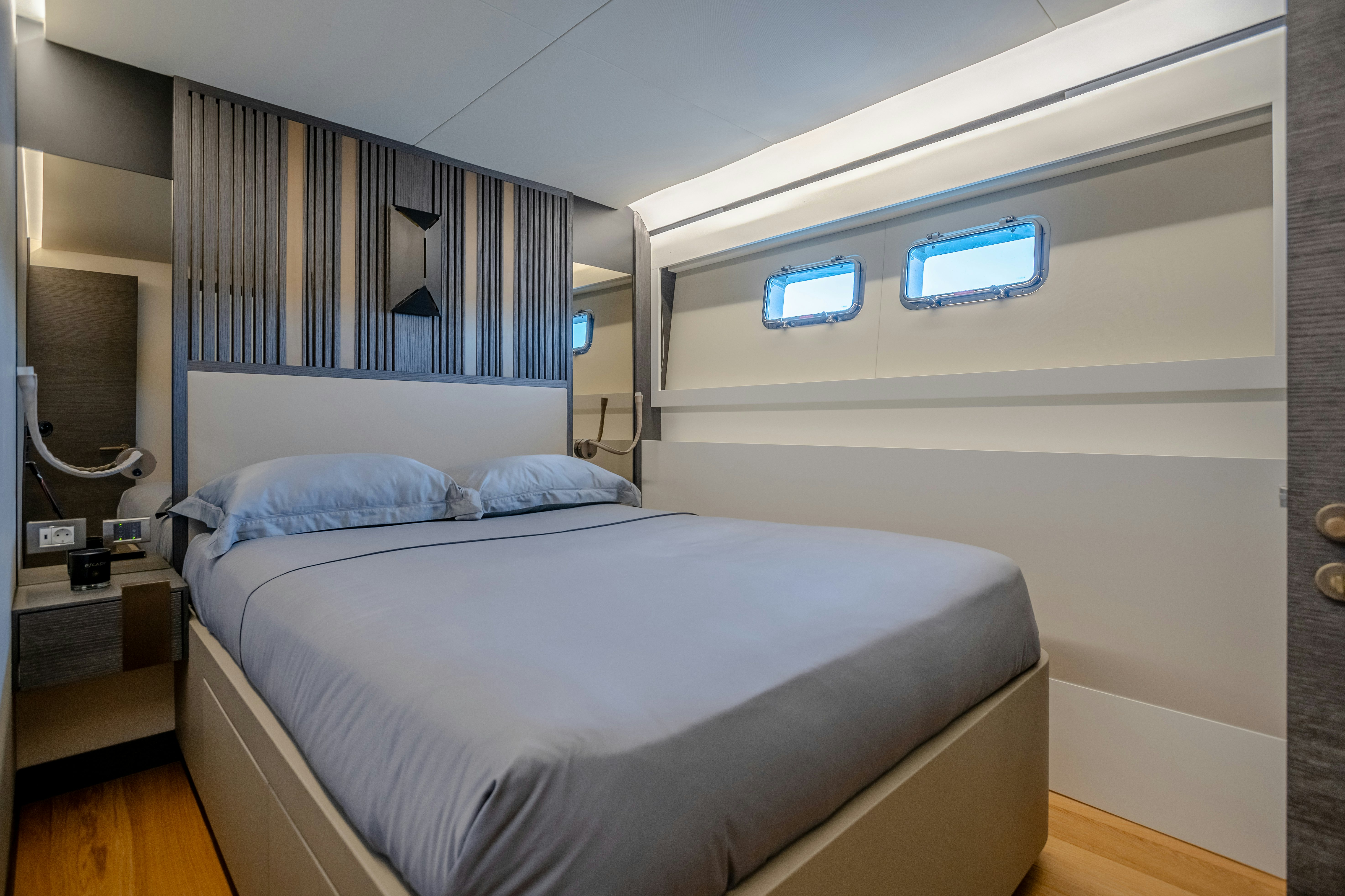 a bed in a room aboard MAORIA Yacht for Sale