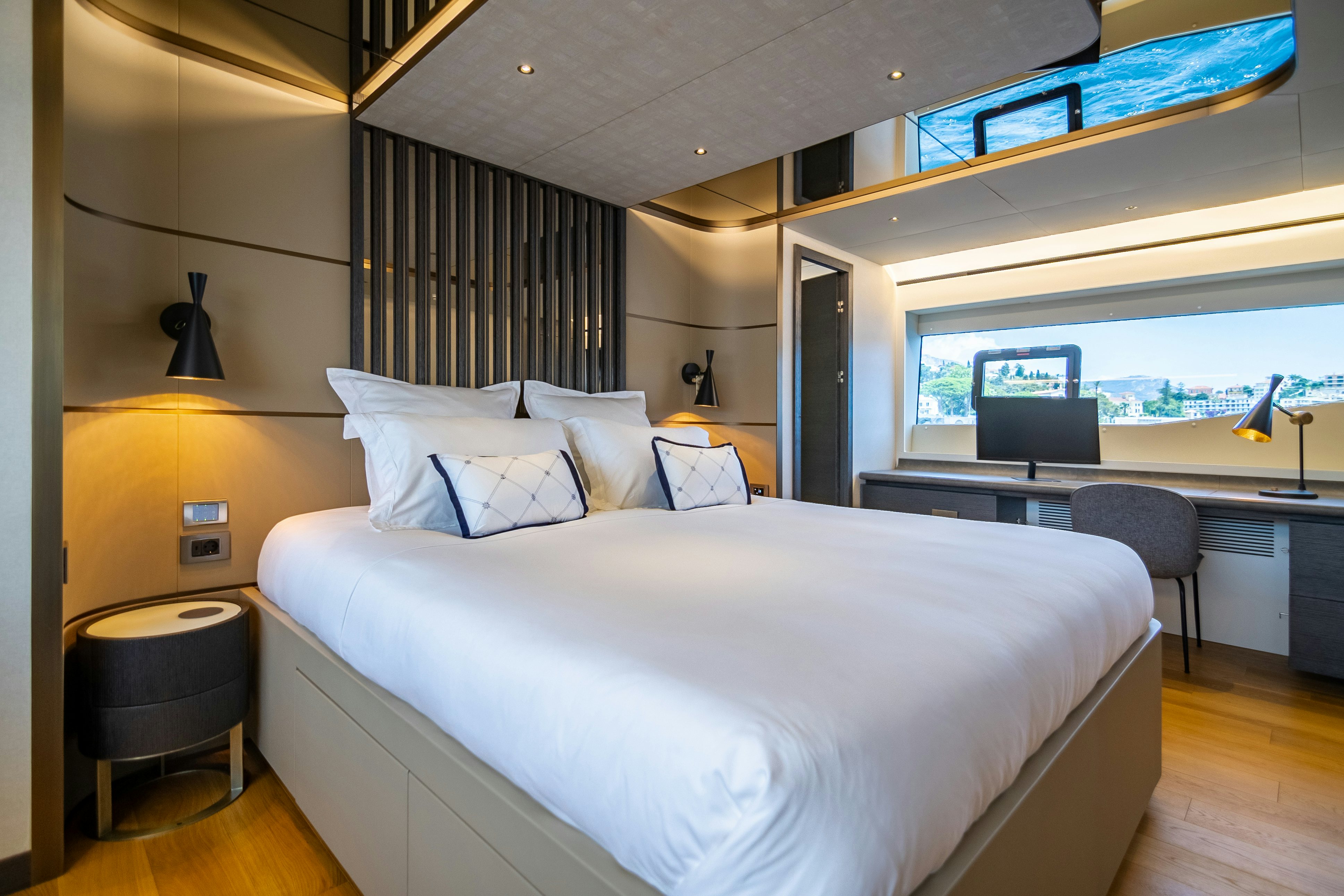 a bed with a white sheet aboard MAORIA Yacht for Sale