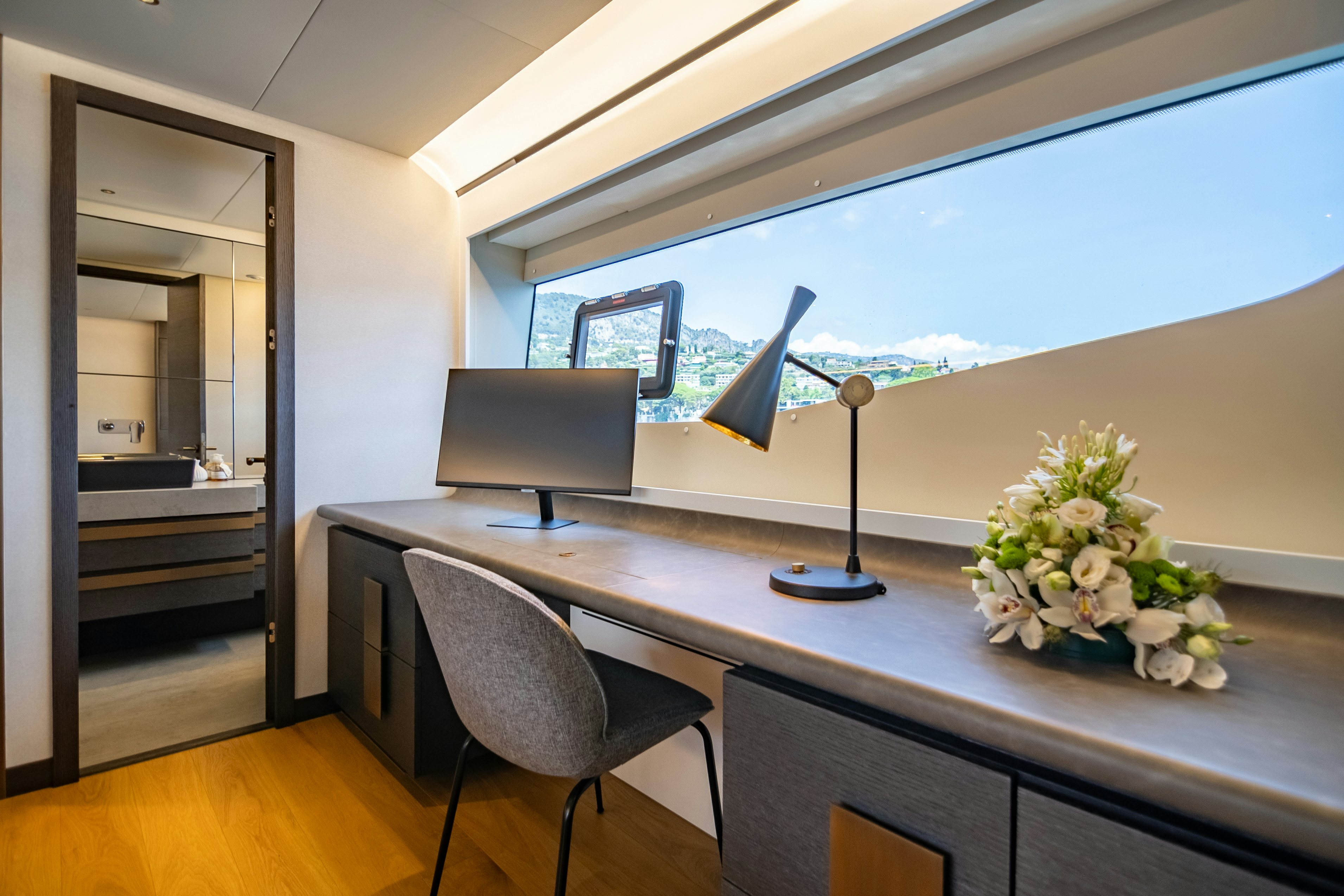 a room with a desk and a chair aboard MAORIA Yacht for Sale