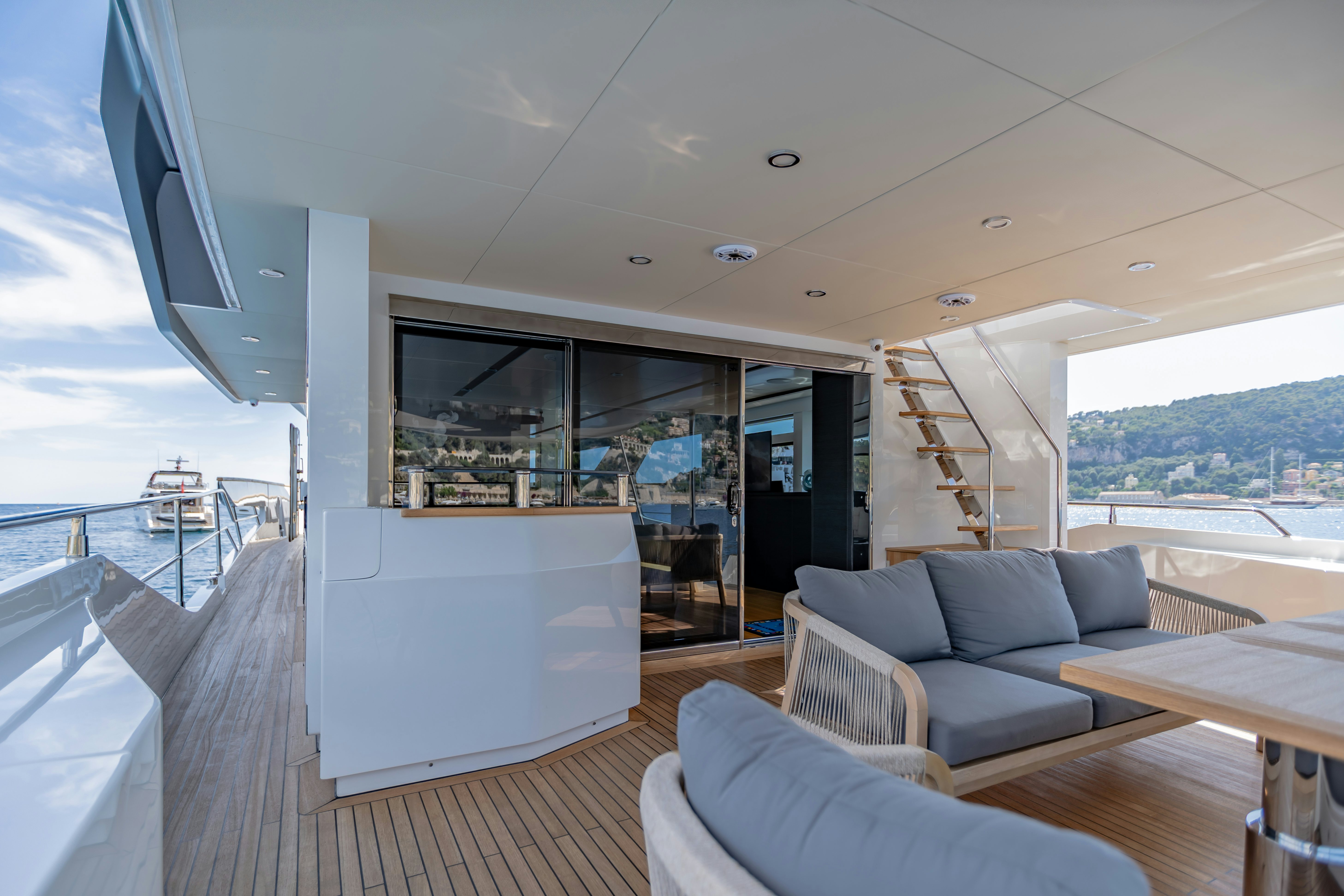 a living room with a large glass window aboard MAORIA Yacht for Sale