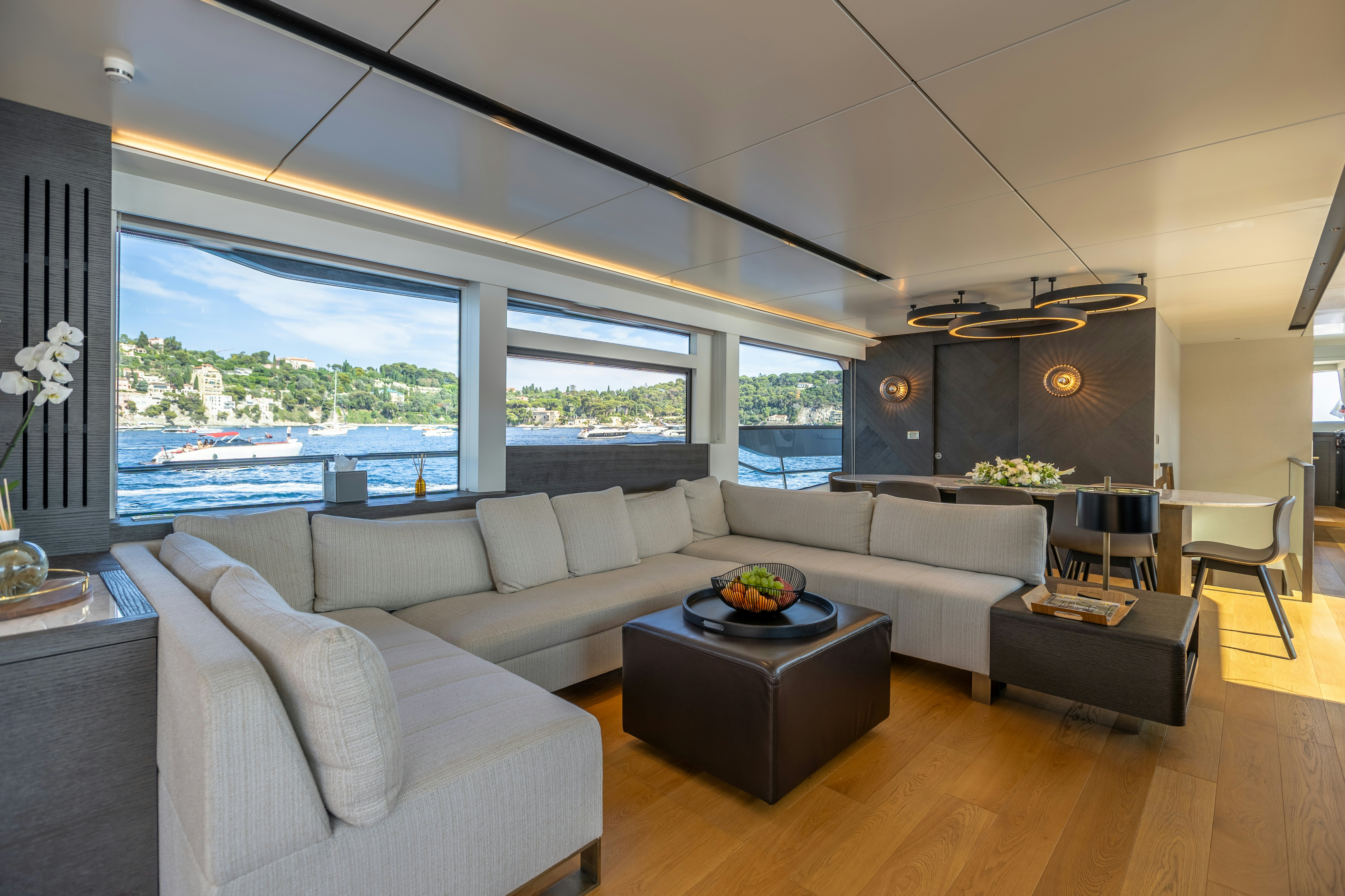a living room with a large window aboard MAORIA Yacht for Sale