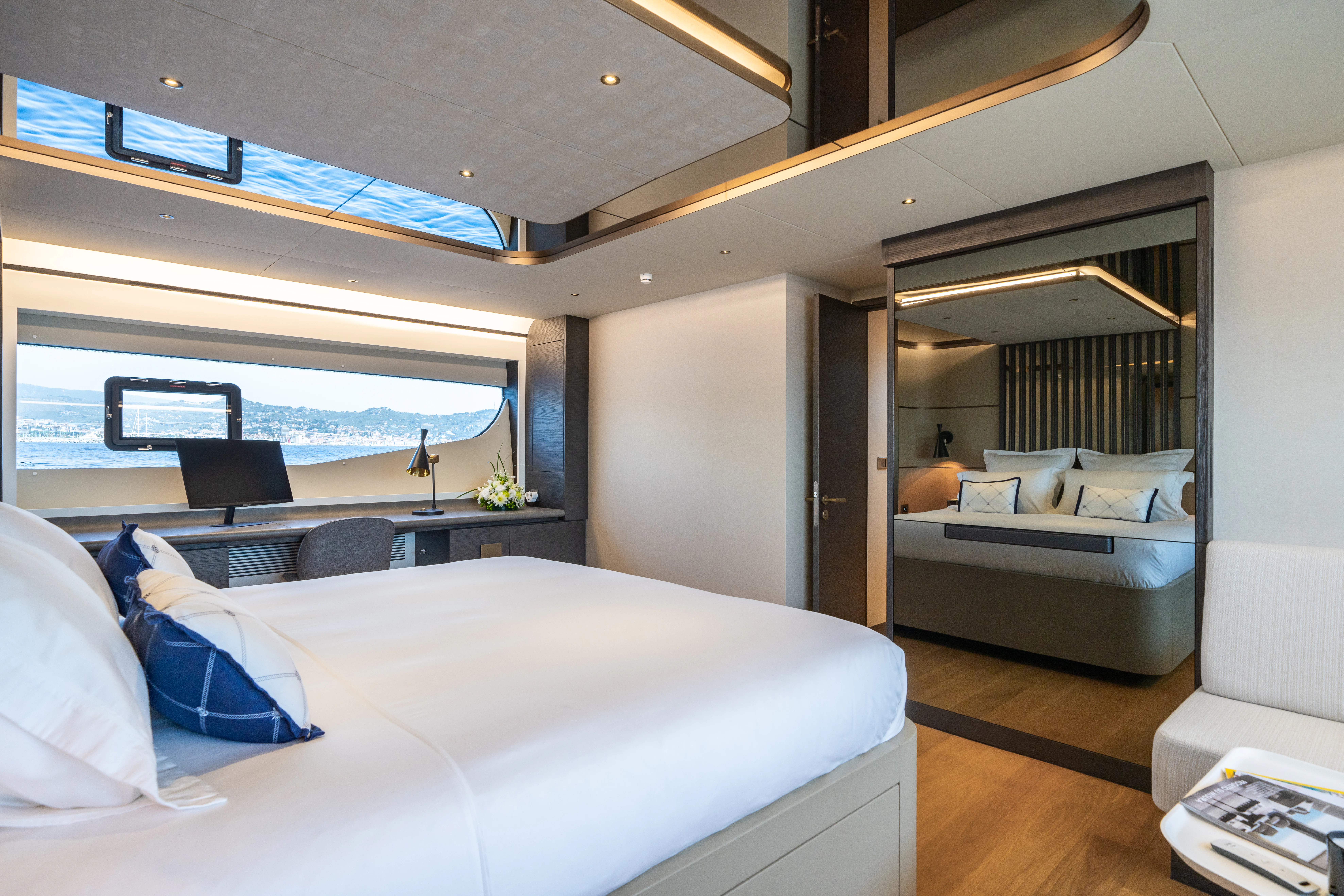 a room with a bed and a window aboard MAORIA Yacht for Charter