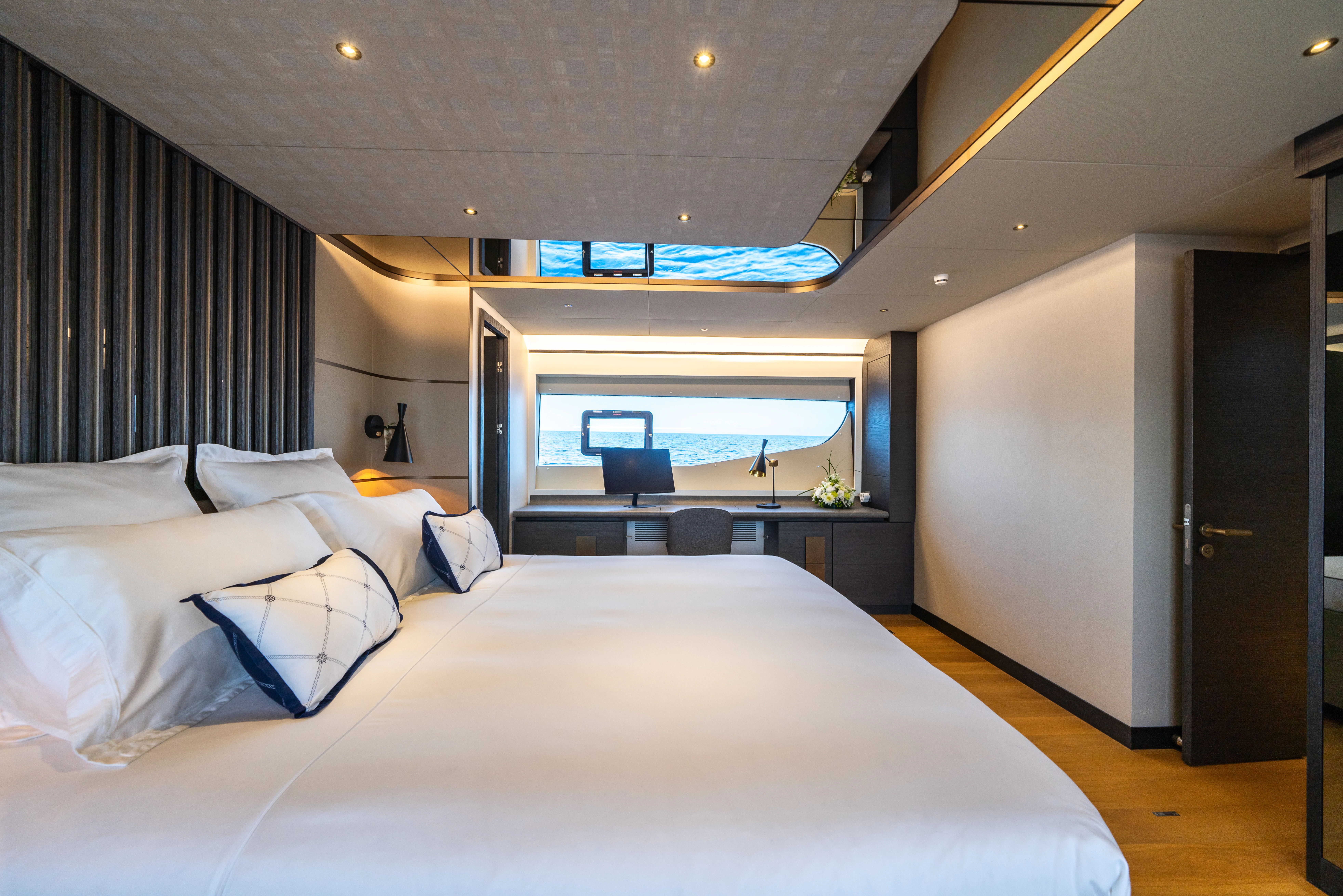 a bed in a room aboard MAORIA Yacht for Charter