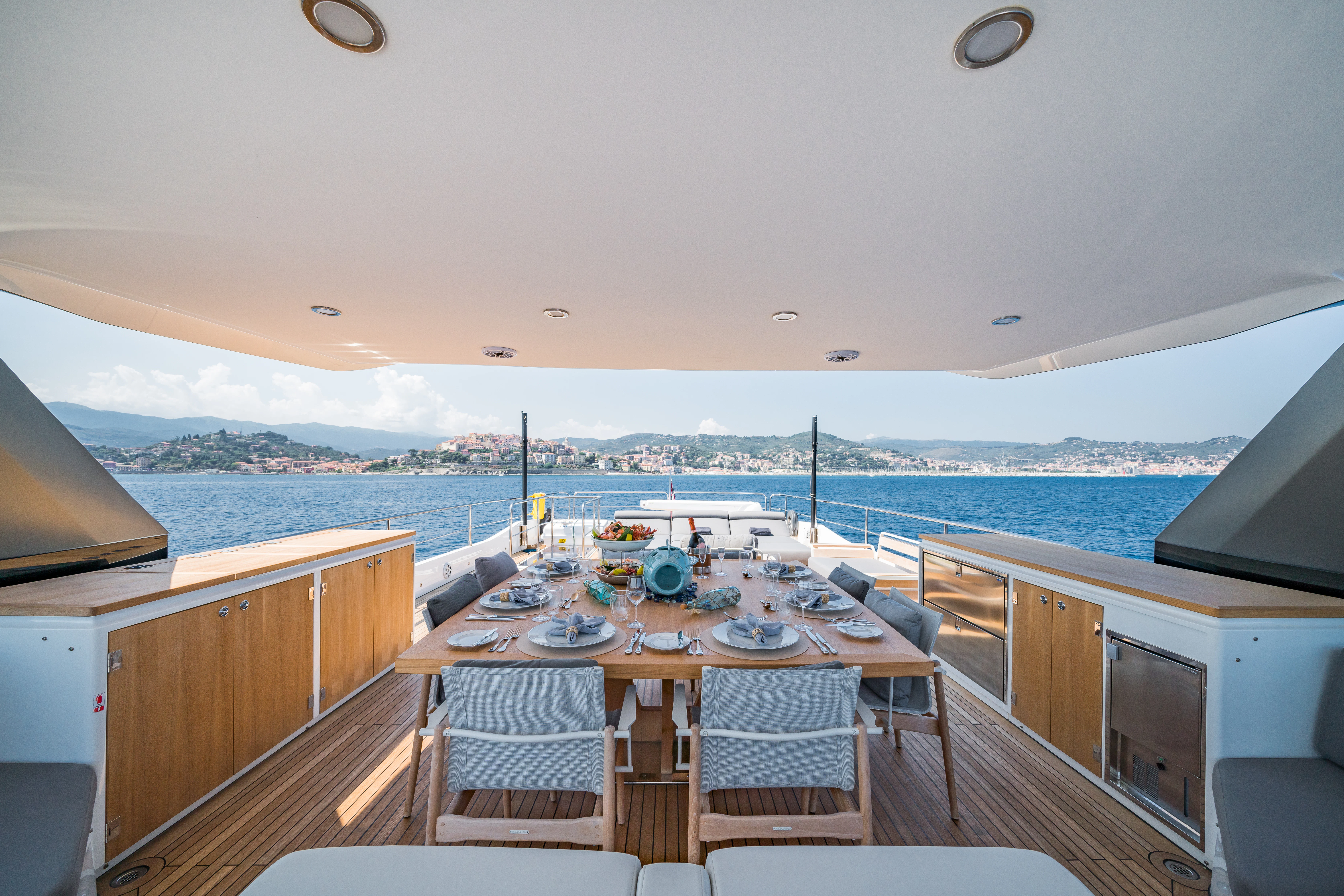 a table set for a meal on a boat aboard MAORIA Yacht for Charter