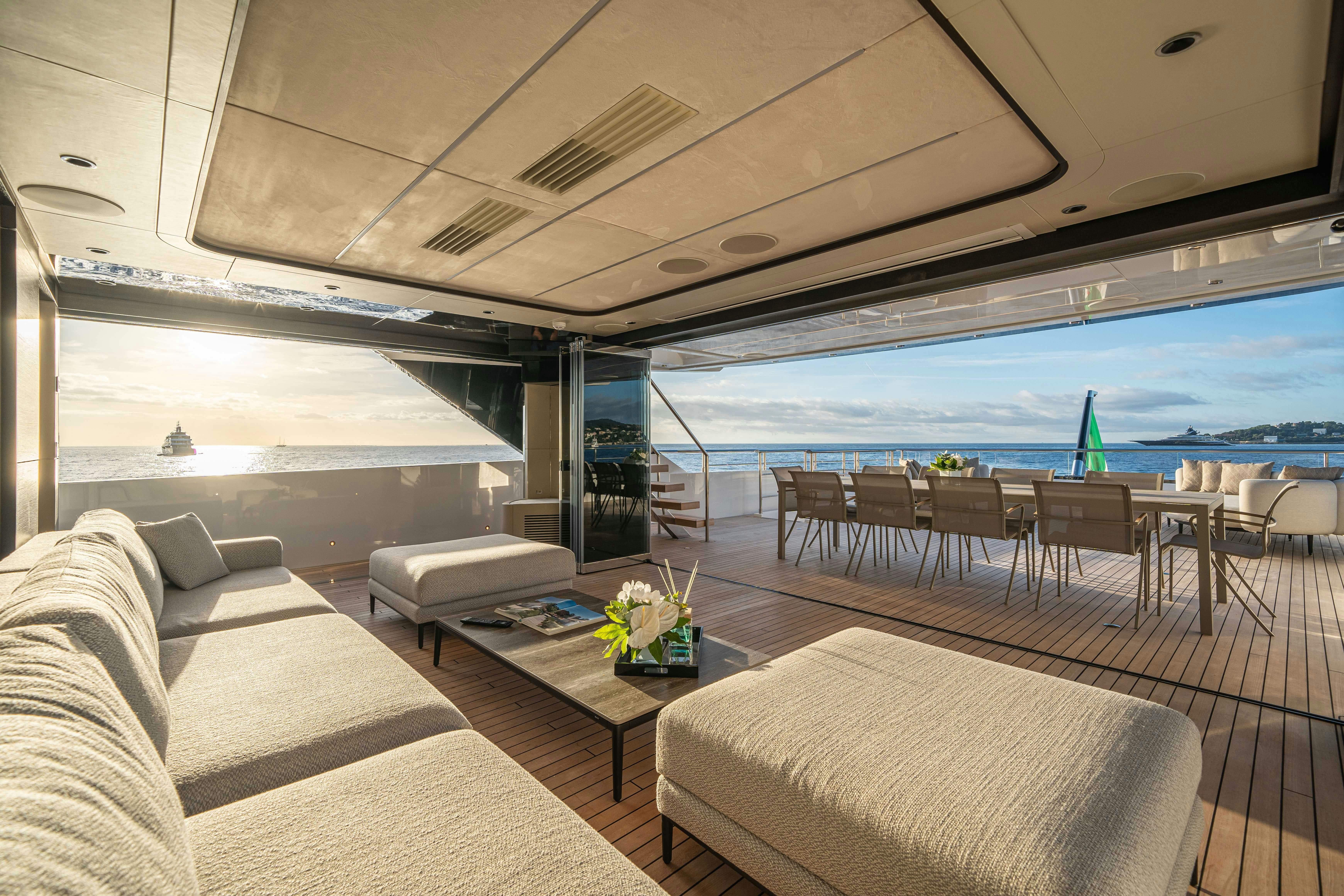 a living room with a large balcony aboard OCEAN KING DUCALE 120 Yacht for Sale