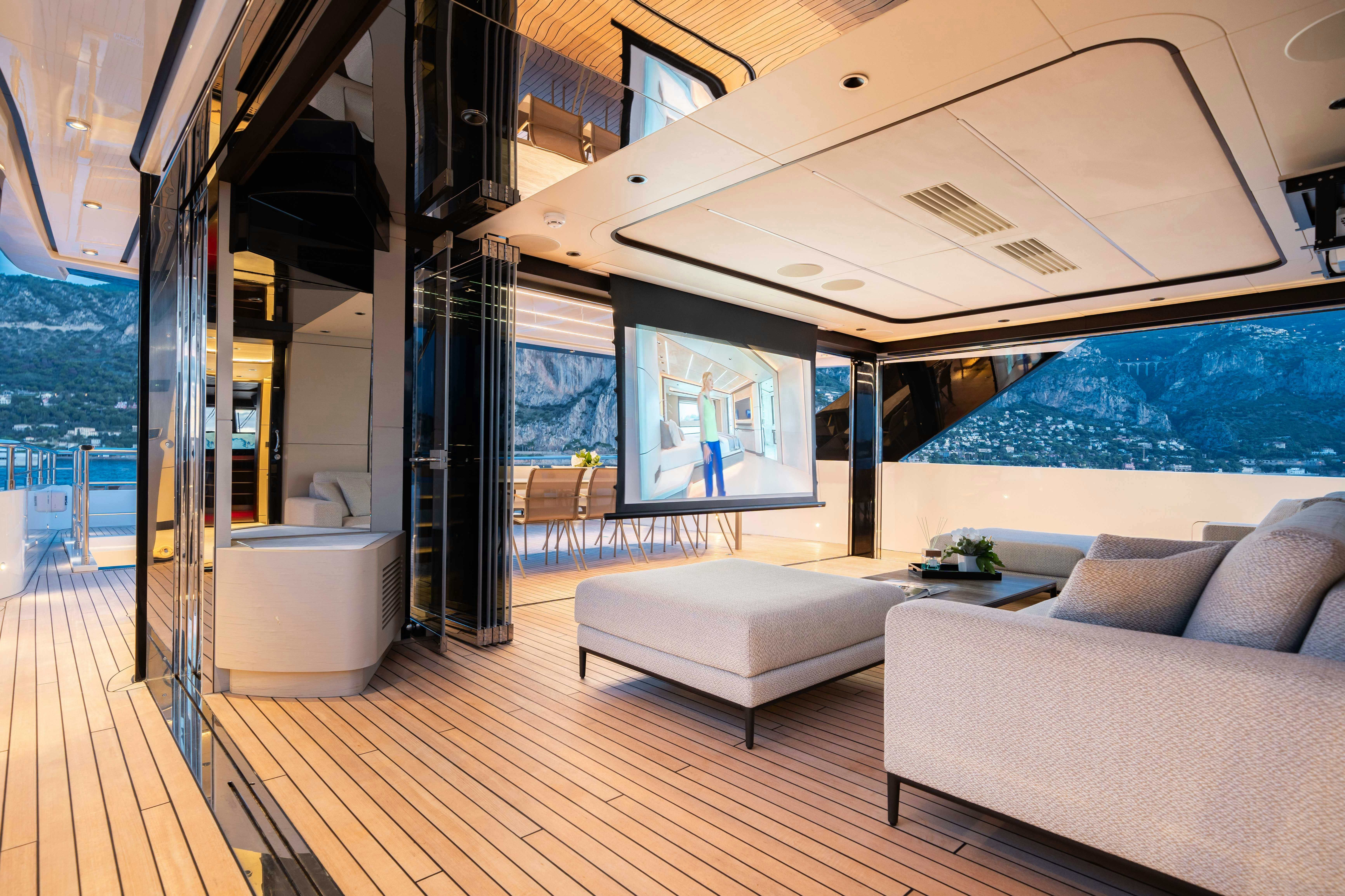 a room with a couch and a table aboard OCEAN KING DUCALE 120 Yacht for Sale