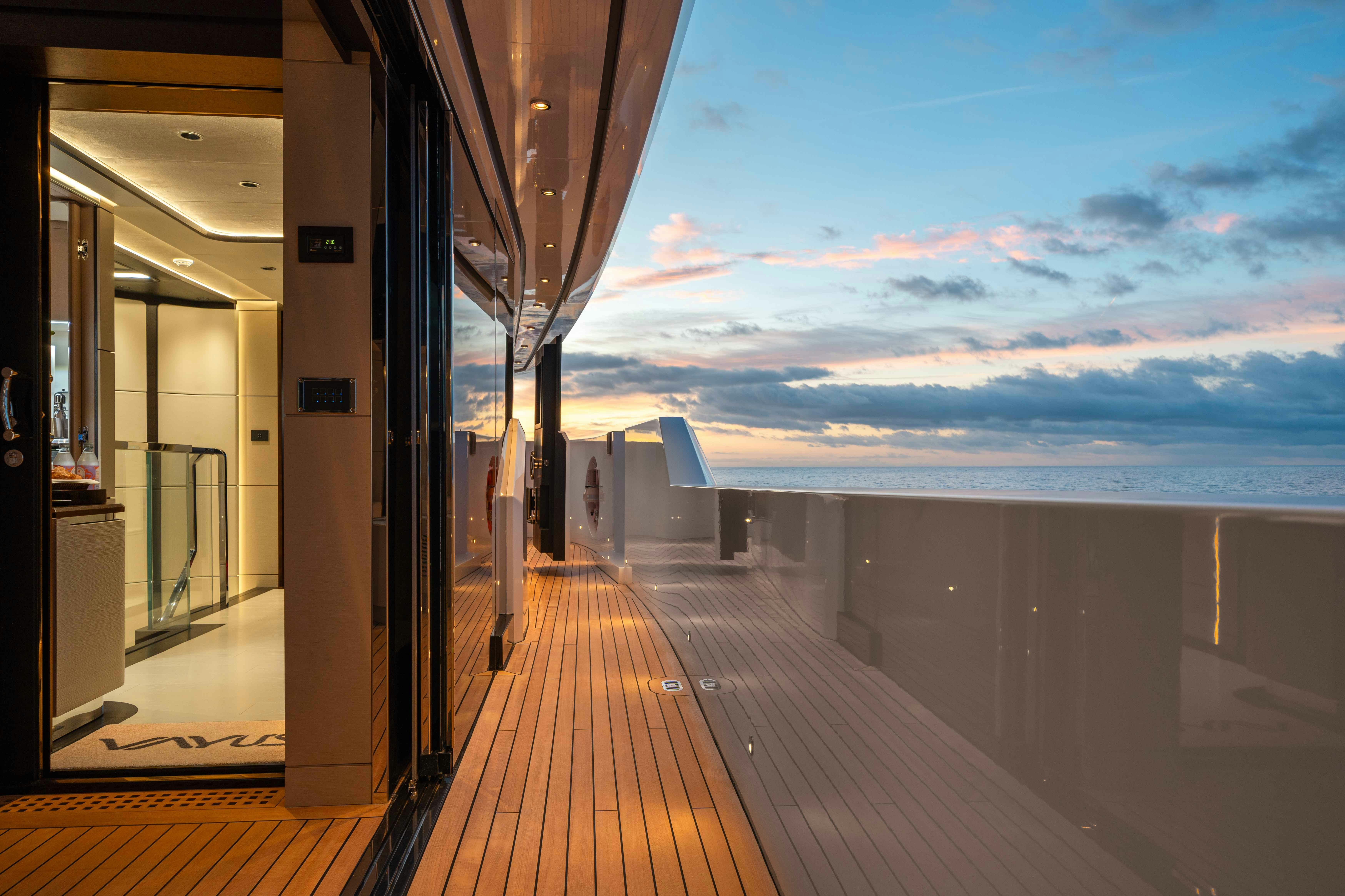 a wooden deck overlooking a body of water aboard OCEAN KING DUCALE 120 Yacht for Sale